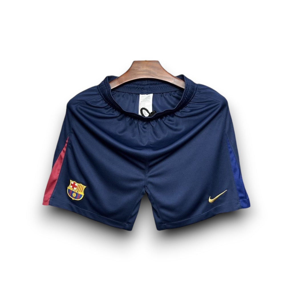 Leazofoot FC Barcelona 24/25 home soccer shorts in navy blue with red side accents and gold team crest and logo.