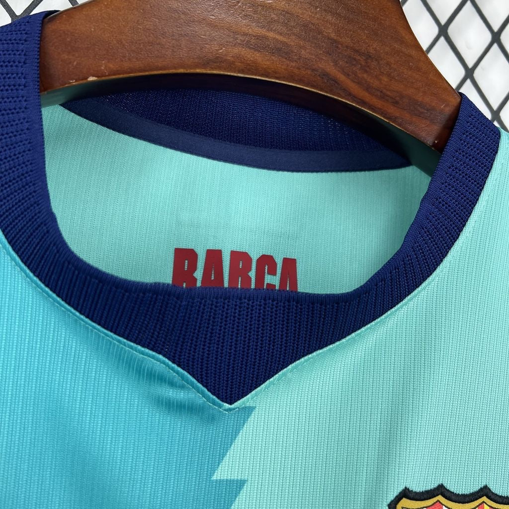 Leazofoot FC Barcelona 26/27 third jersey featuring a light blue design with dark blue collar and BARCA inner print.