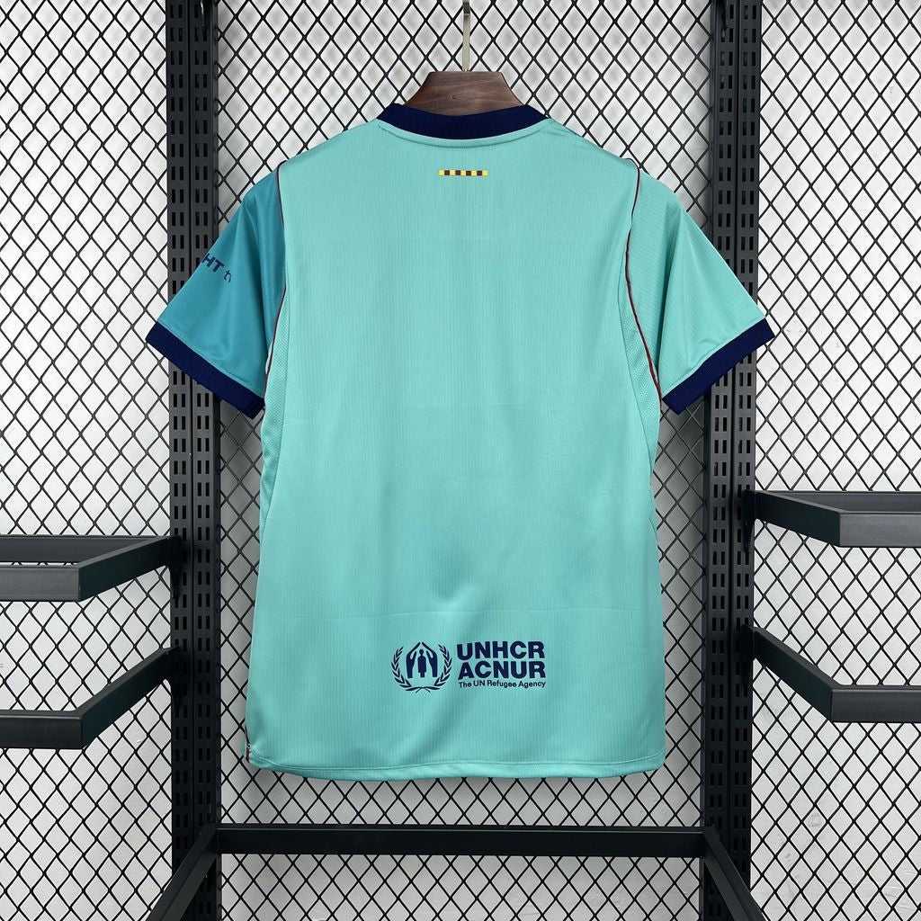 Back view of Leazofoot FC Barcelone 26/27 third jersey in mint green with navy blue trim and UNHCR logo detail.