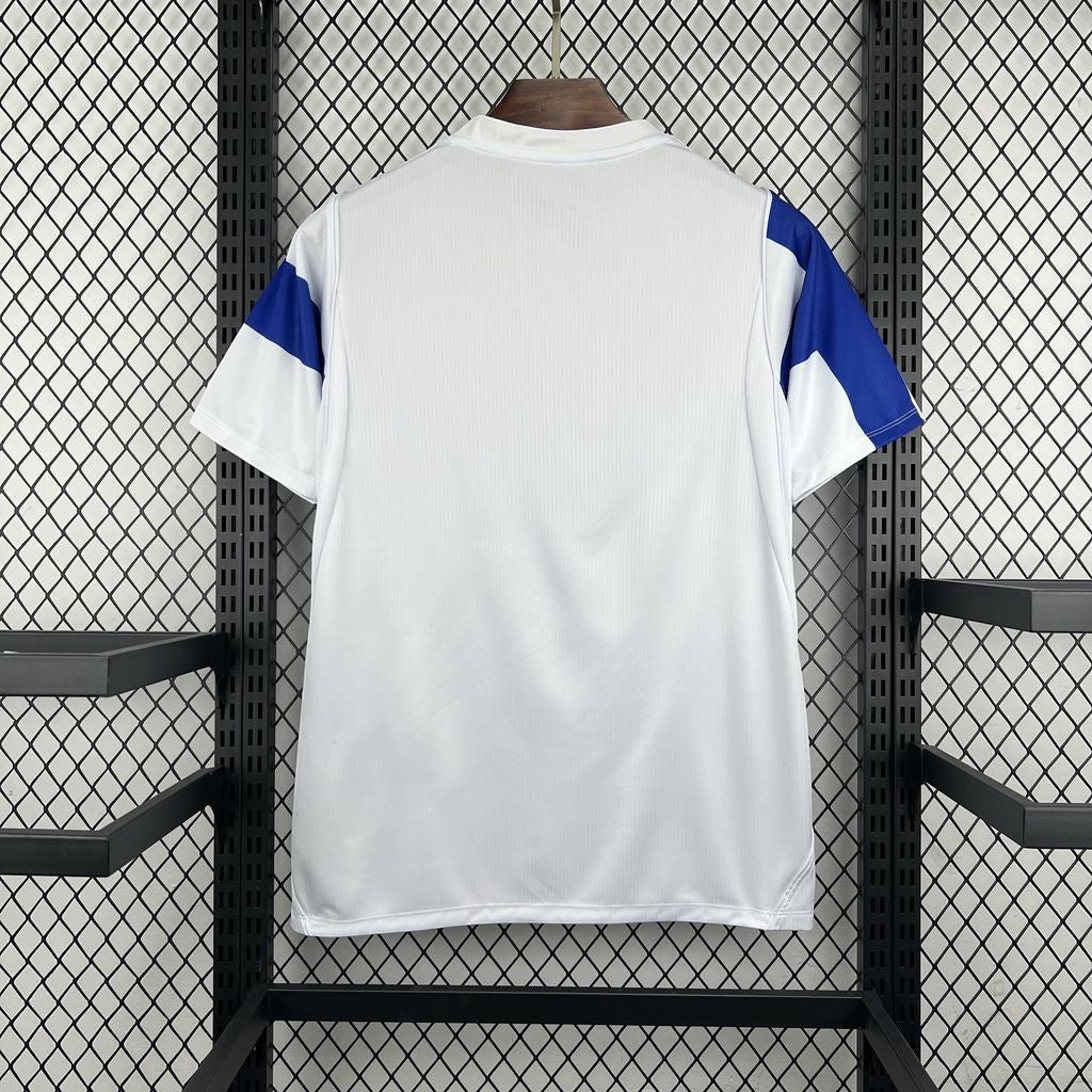 Leazofoot Finland 2026 home soccer jersey in white with blue sleeve accents, back view on a display rack.