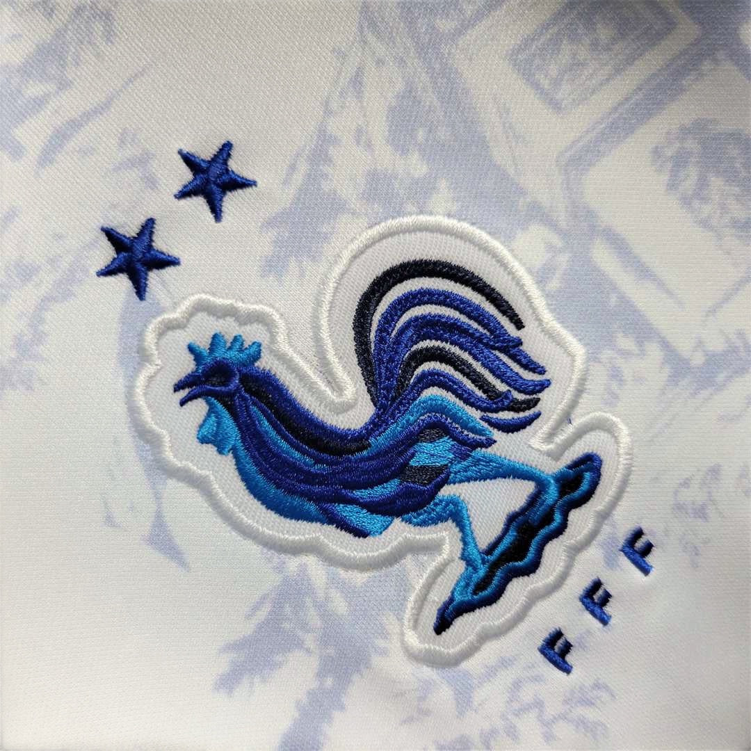 Leazofoot France 2022 away jersey featuring an embroidered blue rooster crest and two stars on a white patterned fabric