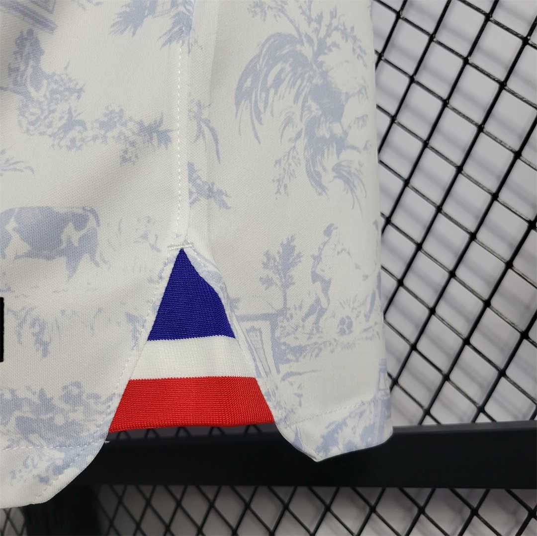 Leazofoot France 2022 away jersey featuring a white toile de jouy print and a tricolor blue white and red hem detail