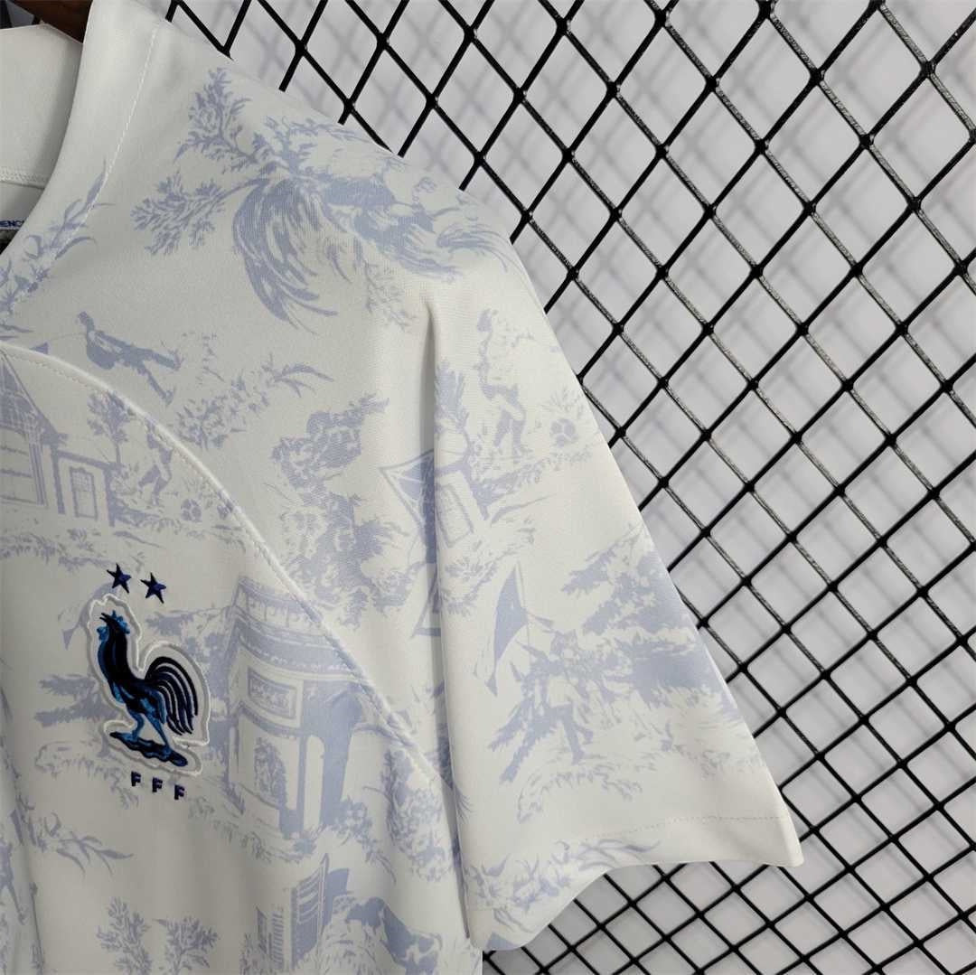 Leazofoot France 2022 away jersey featuring a white and light blue toile de jouy print with the FFF rooster crest.