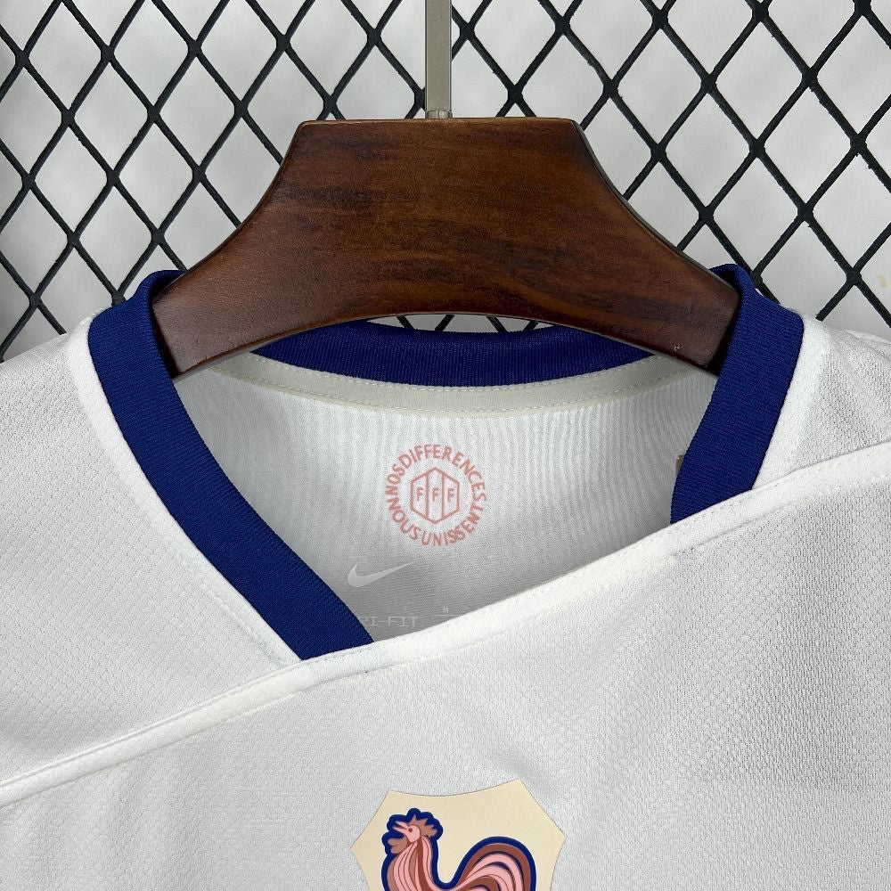 Leazofoot France 2025 away jersey featuring a white textured fabric, blue ribbed collar, and FFF emblem detail.