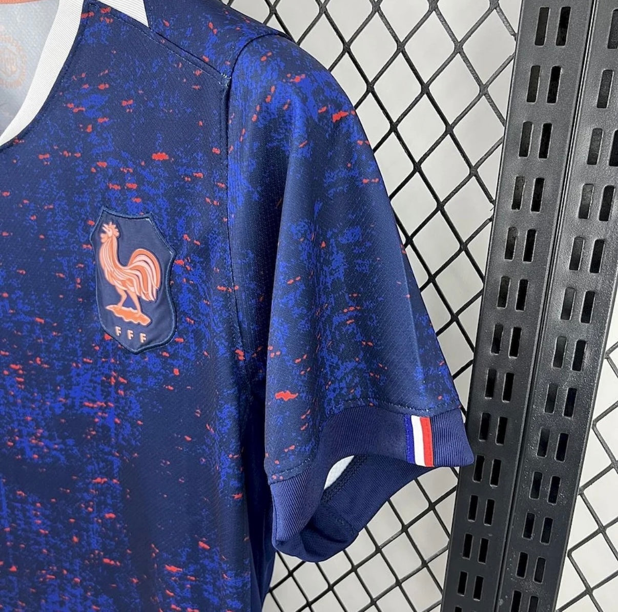 Leazofoot France 2025 home football jersey in navy blue with red speckled pattern and FFF rooster crest