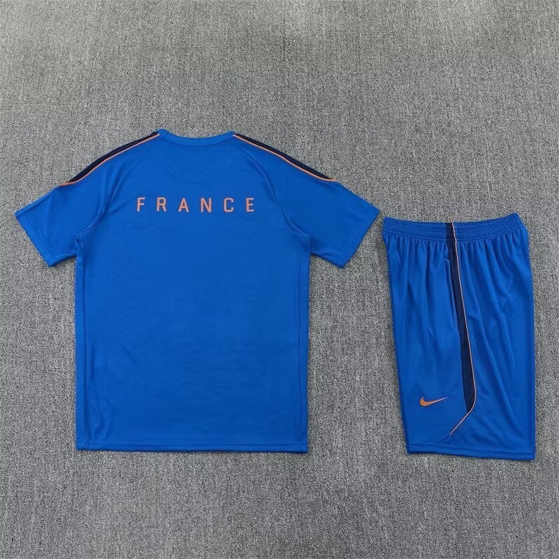 Leazofoot France 2026 blue training set with short-sleeve jersey and matching shorts featuring orange accents