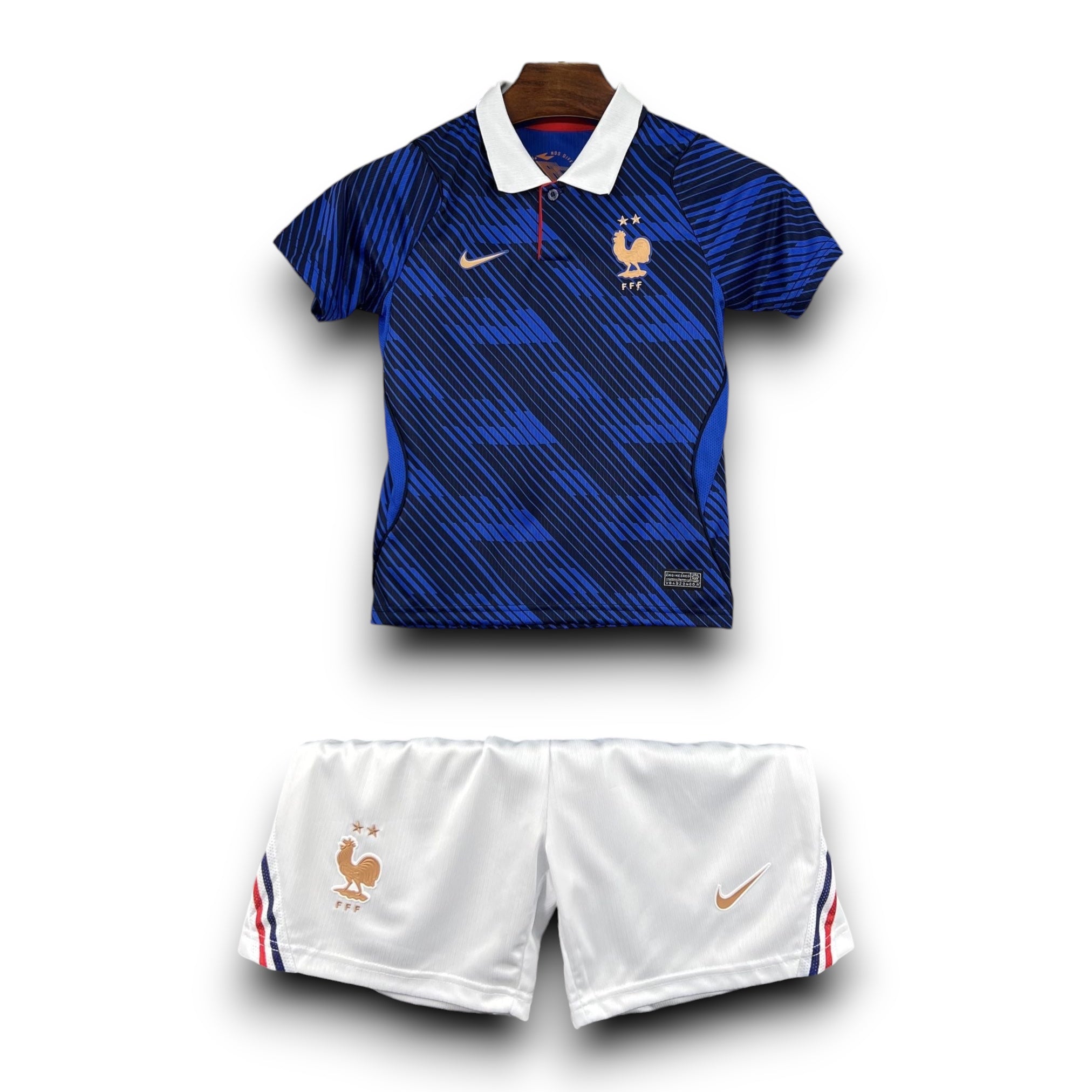 Leazofoot France 2026 home kids football kit with blue patterned jersey, white polo collar, and matching white shorts.