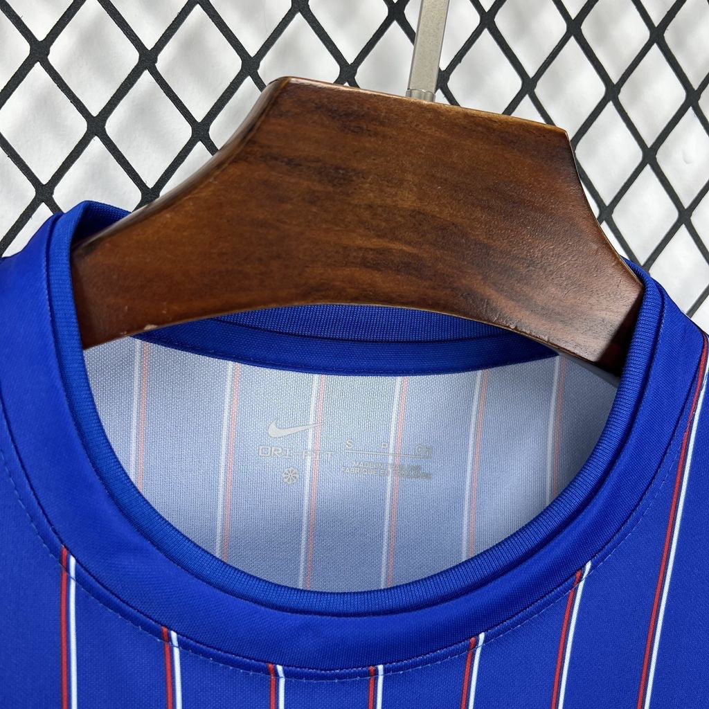 Leazofoot France 2026 pre-match jersey in blue with red and white vertical pinstripes and Dri-FIT technology.