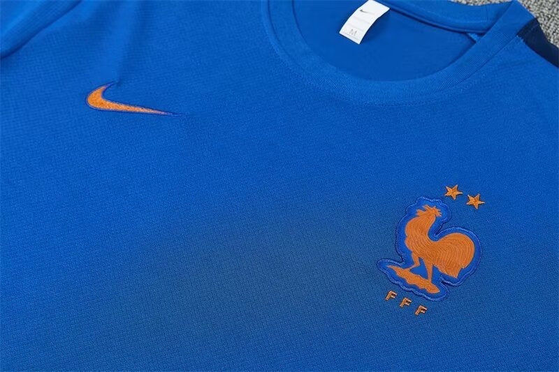 Leazofoot France 2026 training jersey in blue with orange embroidered team crest and Nike swoosh logo