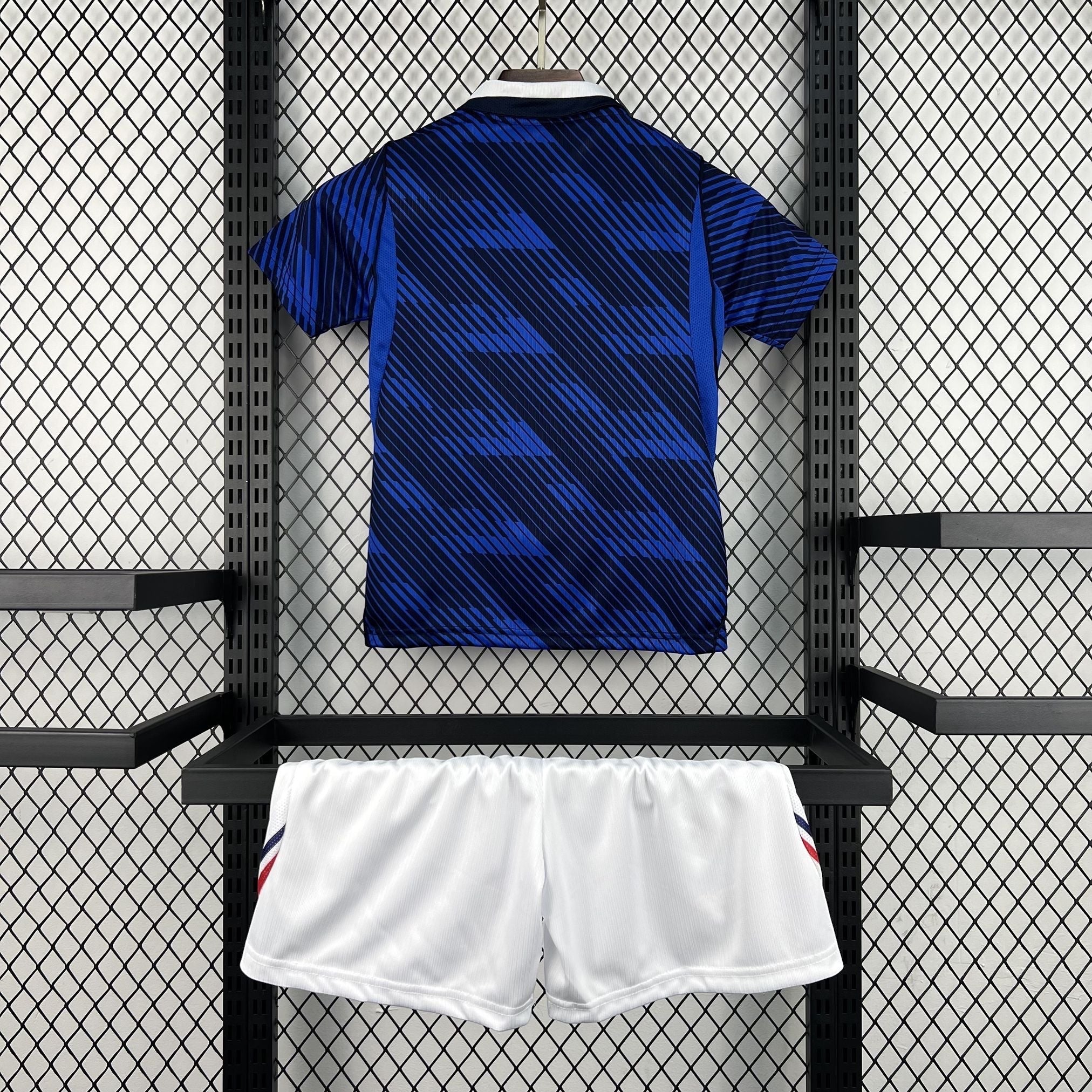 Leazofoot France 2026 kids home kit featuring a blue patterned jersey and white athletic shorts.