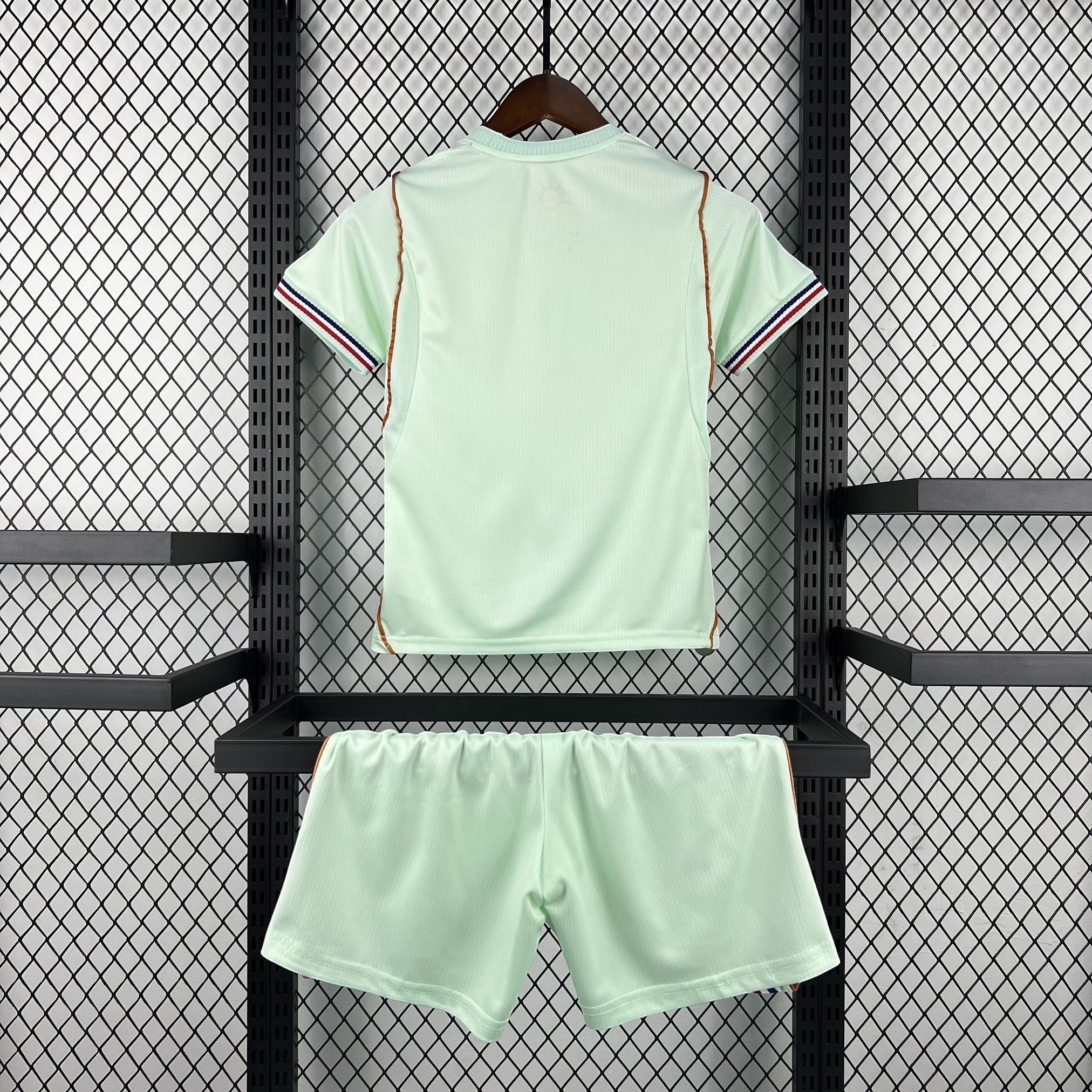 Leazofoot light green children's soccer jersey and shorts set with red, white, and blue striped cuffs.
