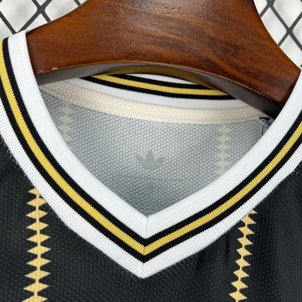 Leazofoot Germany 2026 third soccer jersey featuring a black v-neck with yellow and white striped ribbed trim.