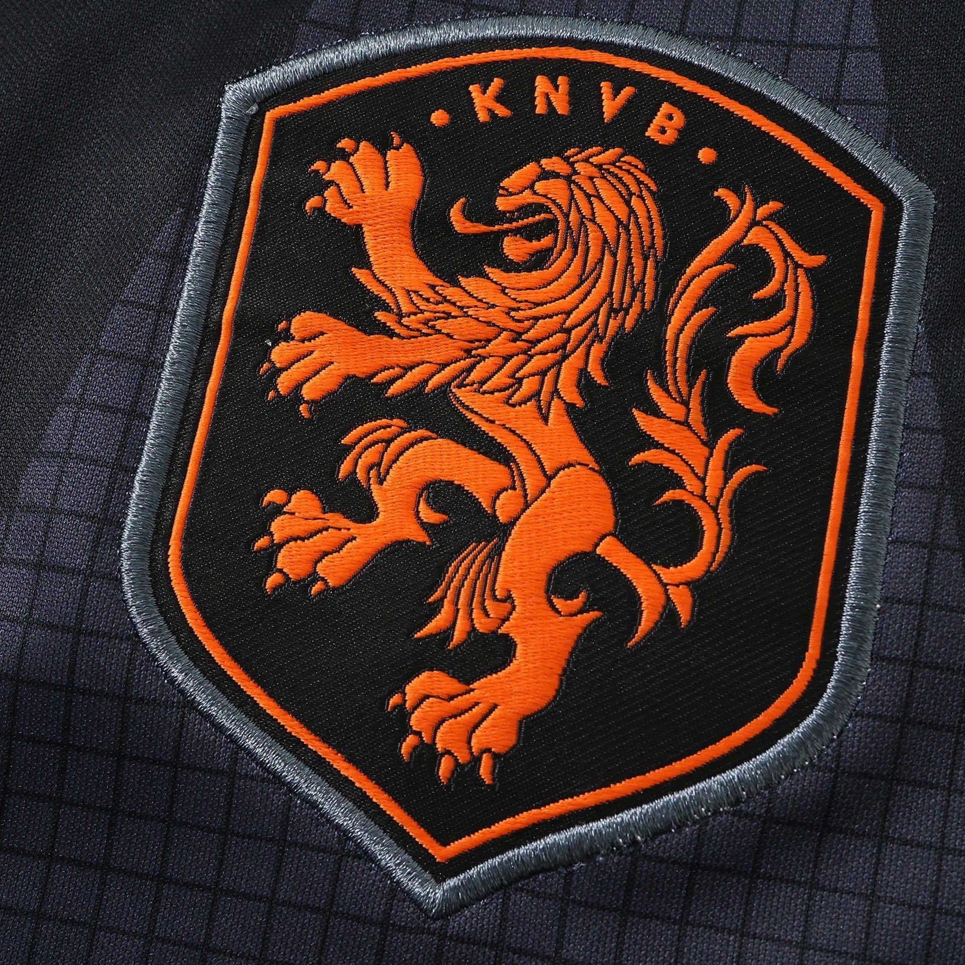 Leazofoot black long-sleeve goalkeeper jersey with orange lion crest and KNVB text.
