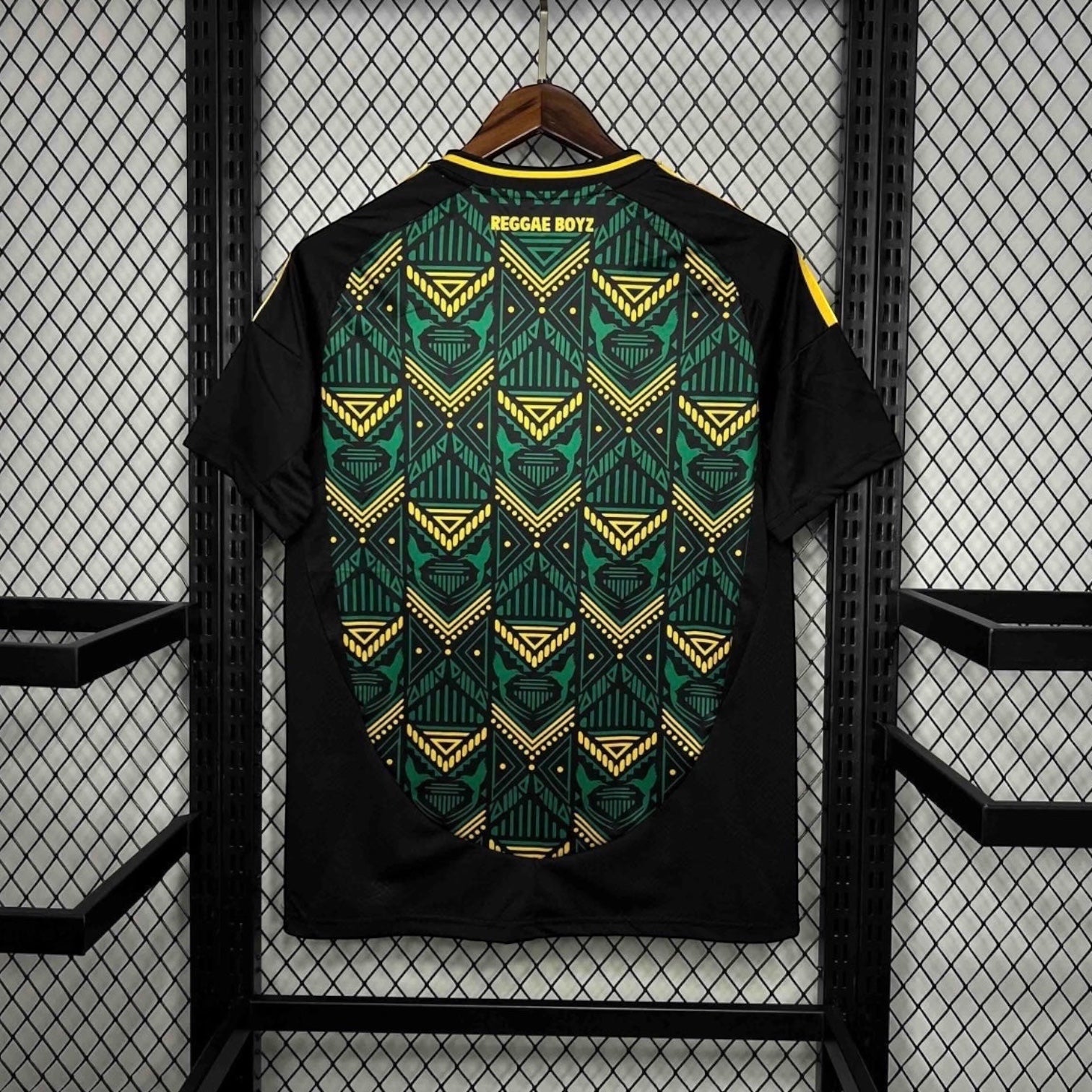 Leazofoot Jamaica 2024 away football jersey in black with green and yellow geometric pattern and Reggae Boyz text.