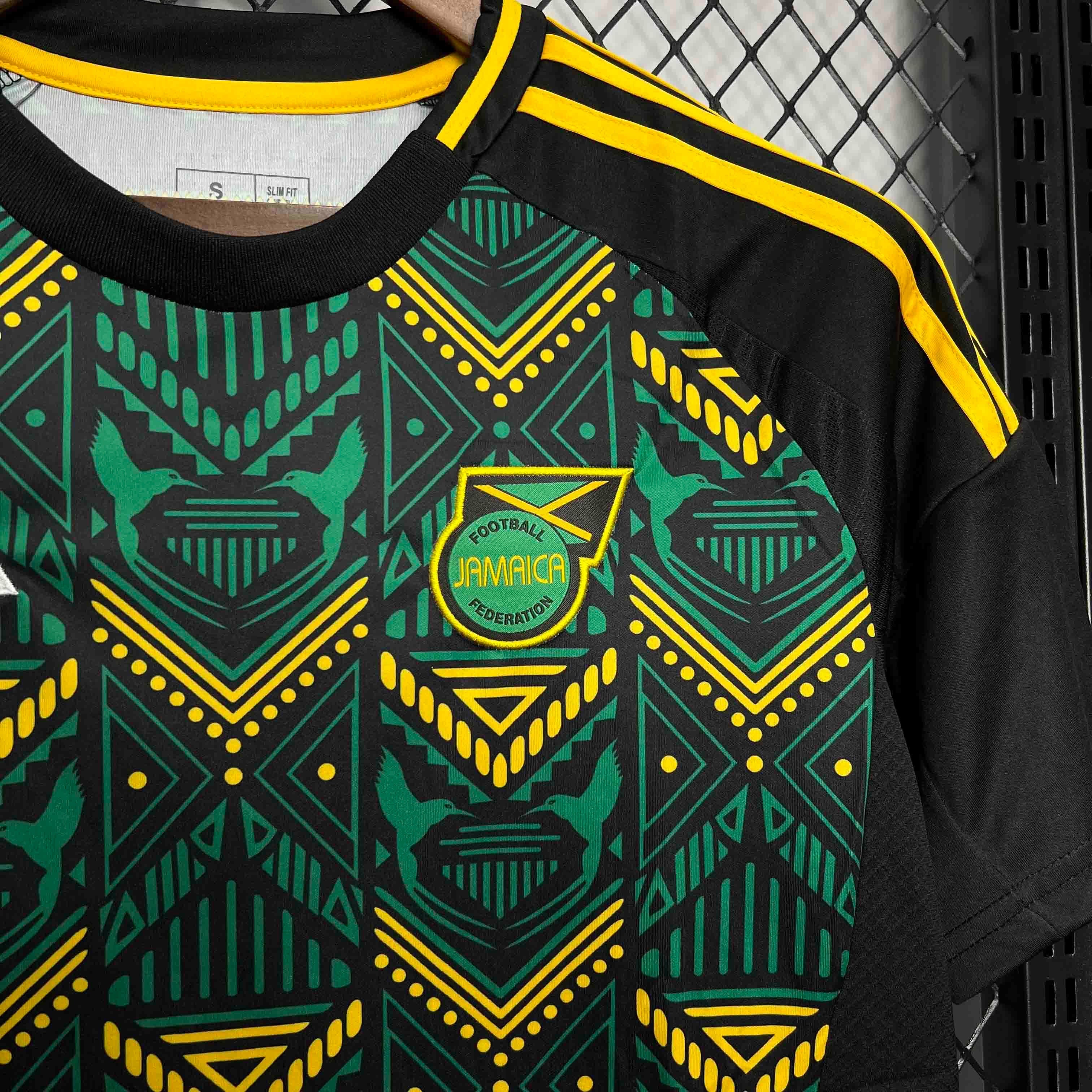 Leazofoot Jamaica 2024 away football jersey with black, green, and yellow geometric pattern and team crest.