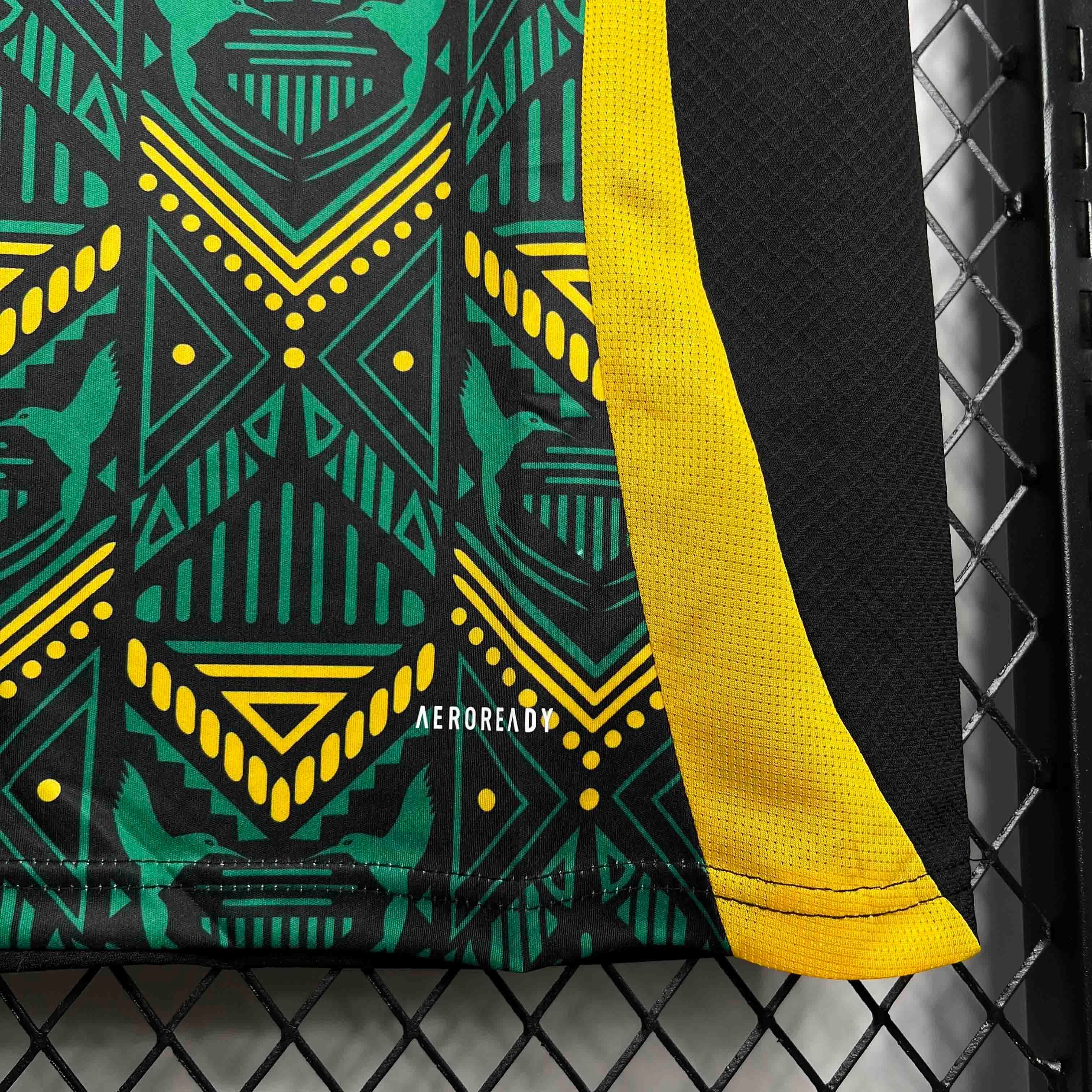 Leazofoot Jamaica 2024 away soccer jersey featuring a black, green, and yellow geometric pattern with Aeroready tech.