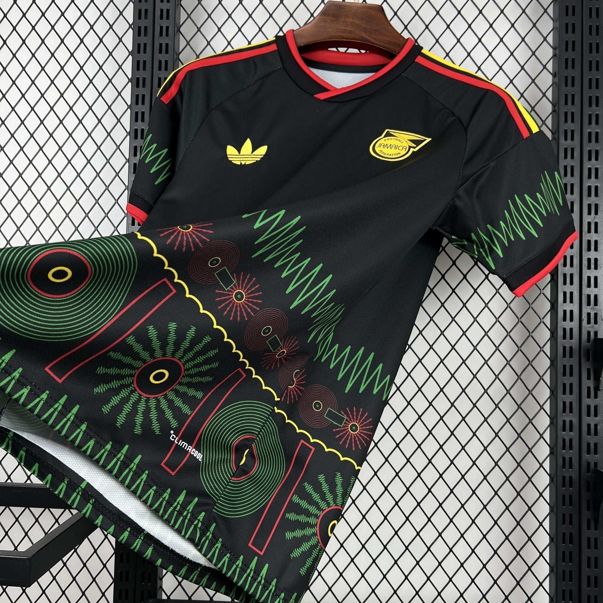 Leazofoot Jamaica 2026 away football jersey in black with green, yellow, and red graphic patterns and team crest.