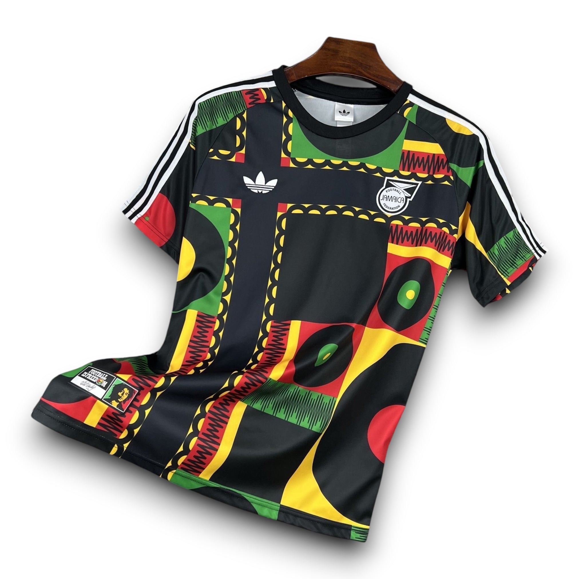 Leazofoot Jamaica 2026 concept football jersey in black, green, yellow, and red with geometric patterns and logo.