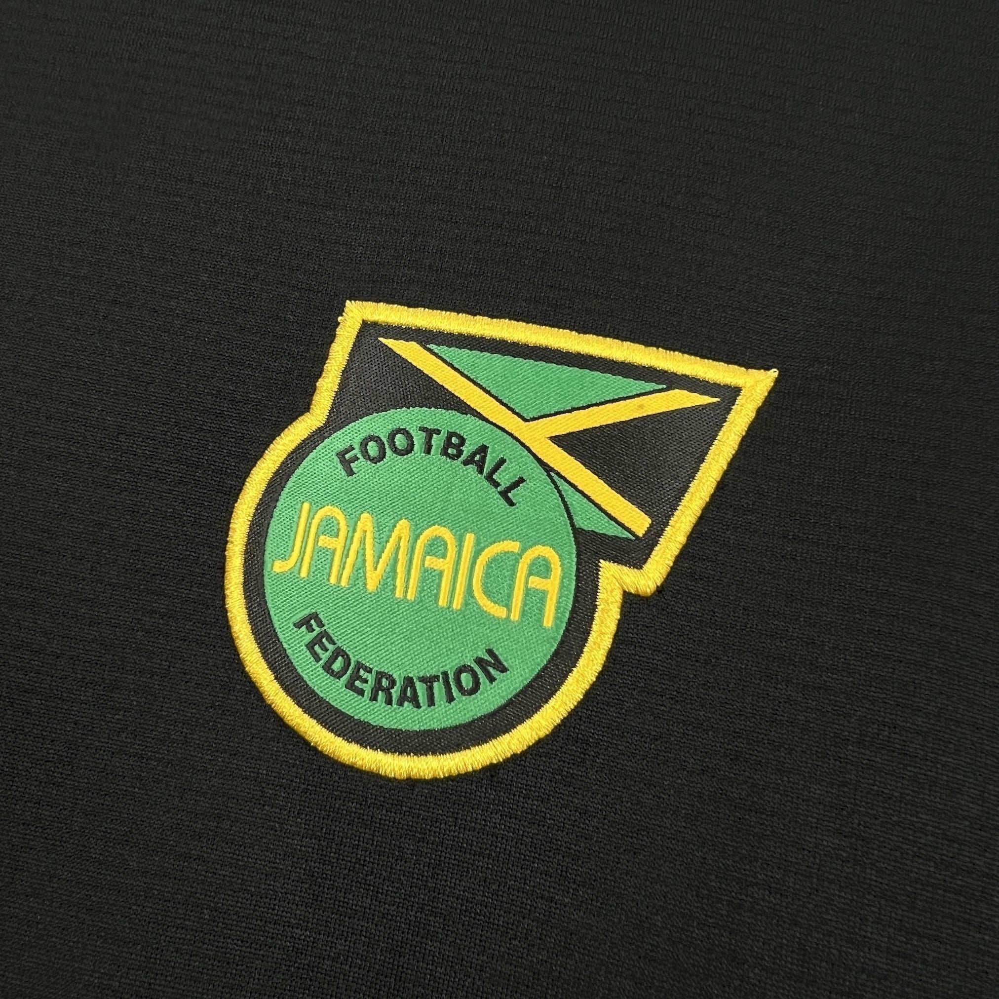 Leazofoot Jamaica 2026 concept football jersey featuring an embroidered Jamaica Football Federation crest on black fabric