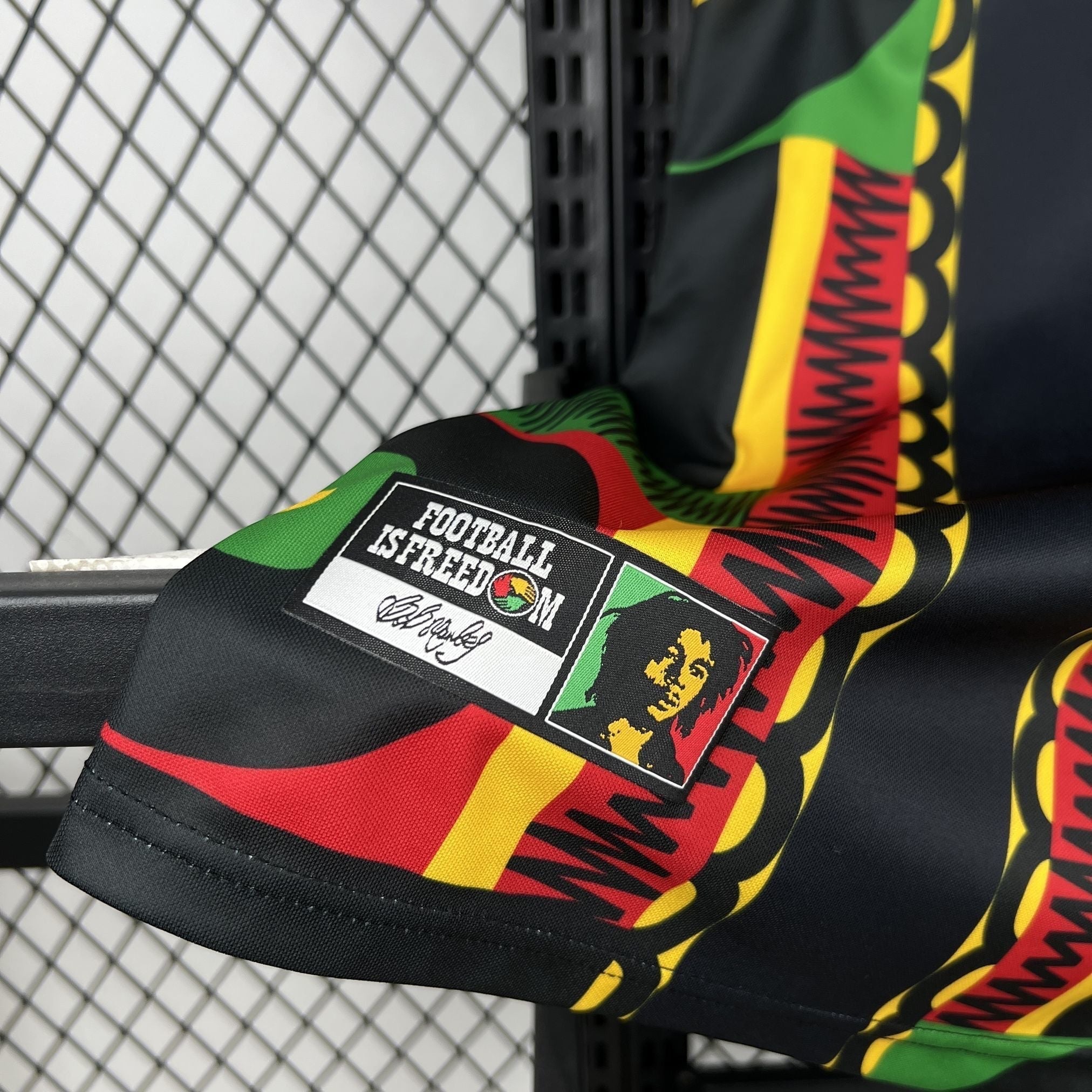 Leazofoot Jamaica 2026 concept football jersey in black, green, yellow, and red with Bob Marley graphic patch.