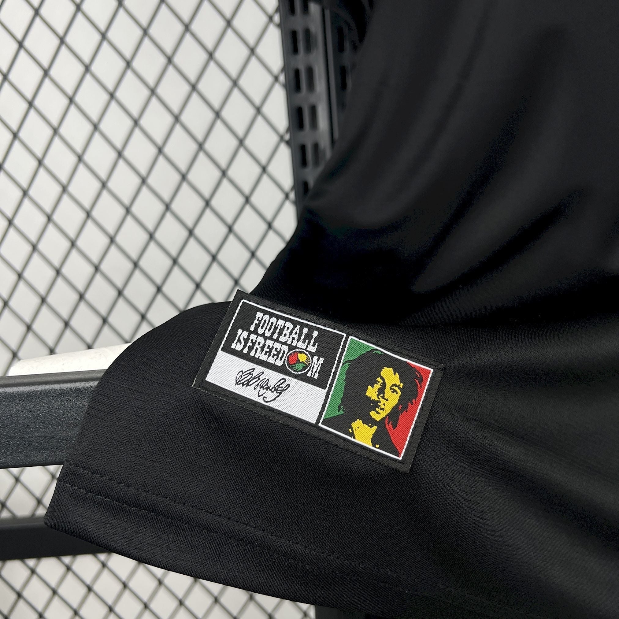 Leazofoot Jamaica 2026 concept football jersey in black with a Bob Marley Football Is Freedom patch detail.