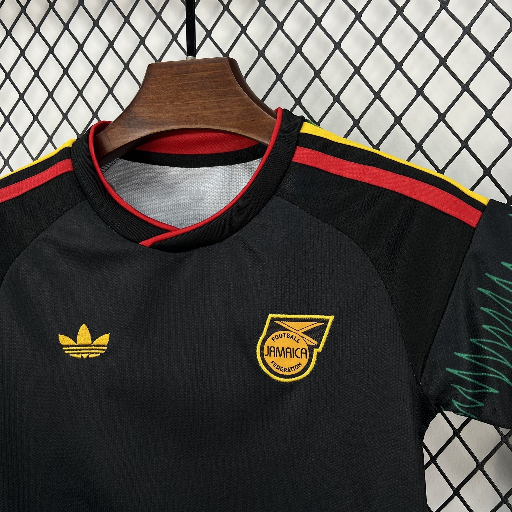 Leazofoot Jamaica 2026 kids away football jersey in black with red and yellow accents and team crest.