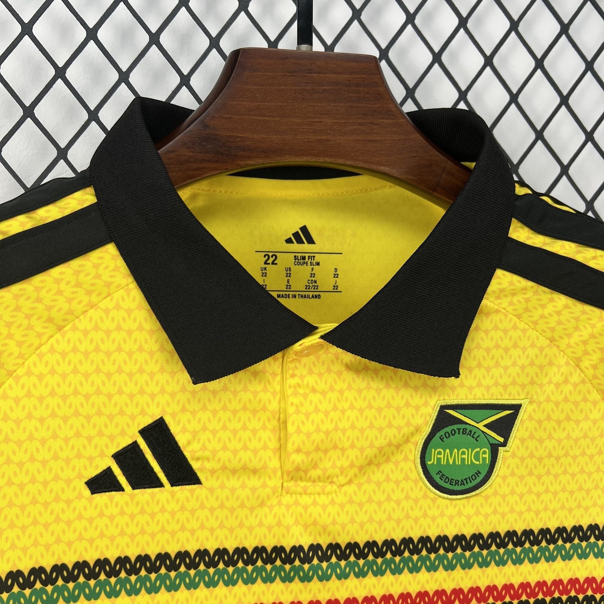 Leazofoot Jamaica 2026 kids home football jersey in yellow with black collar, adidas logo, and team crest.