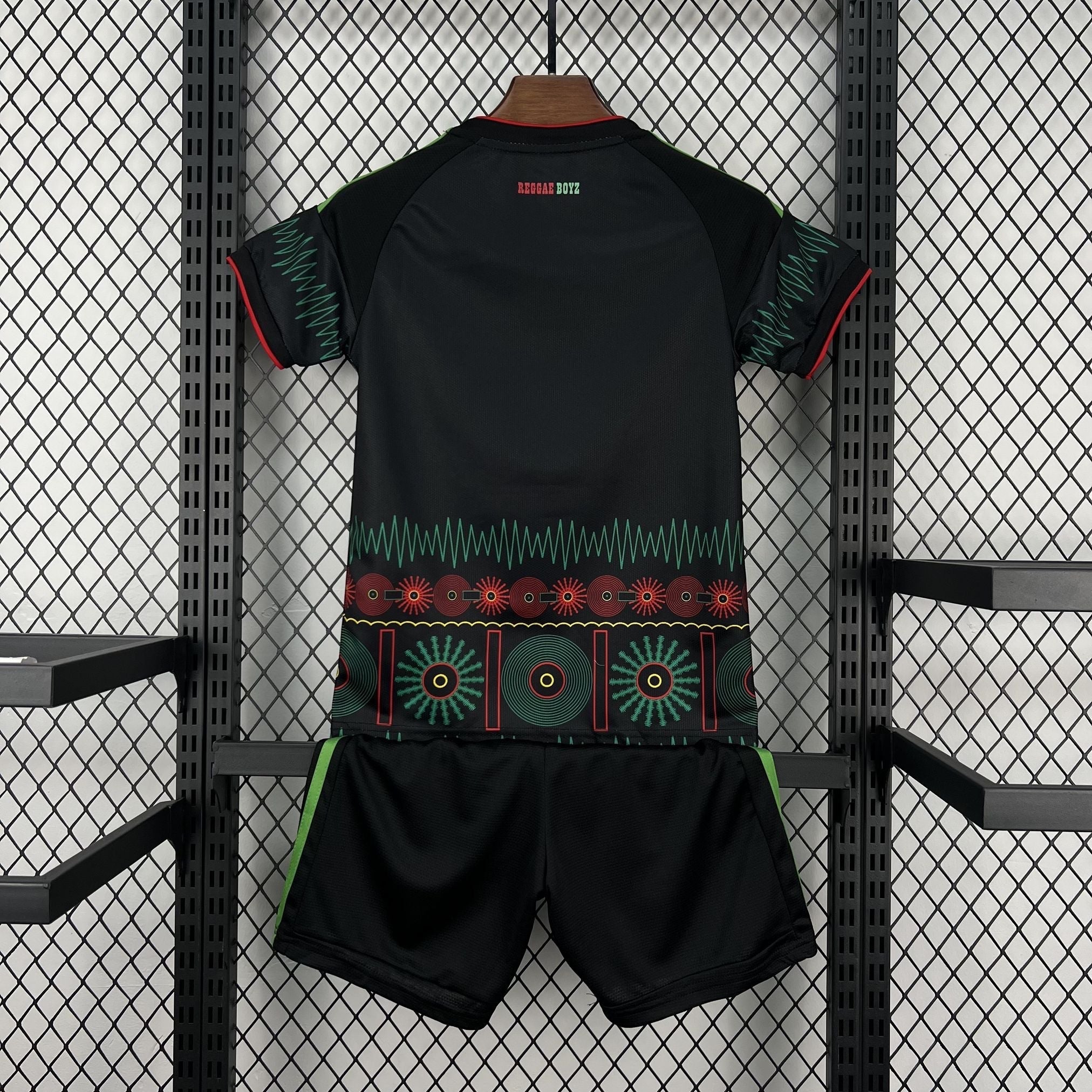 Leazofoot Jamaica 2026 kids away soccer kit in black with green and red graphic patterns and Reggae Boyz text