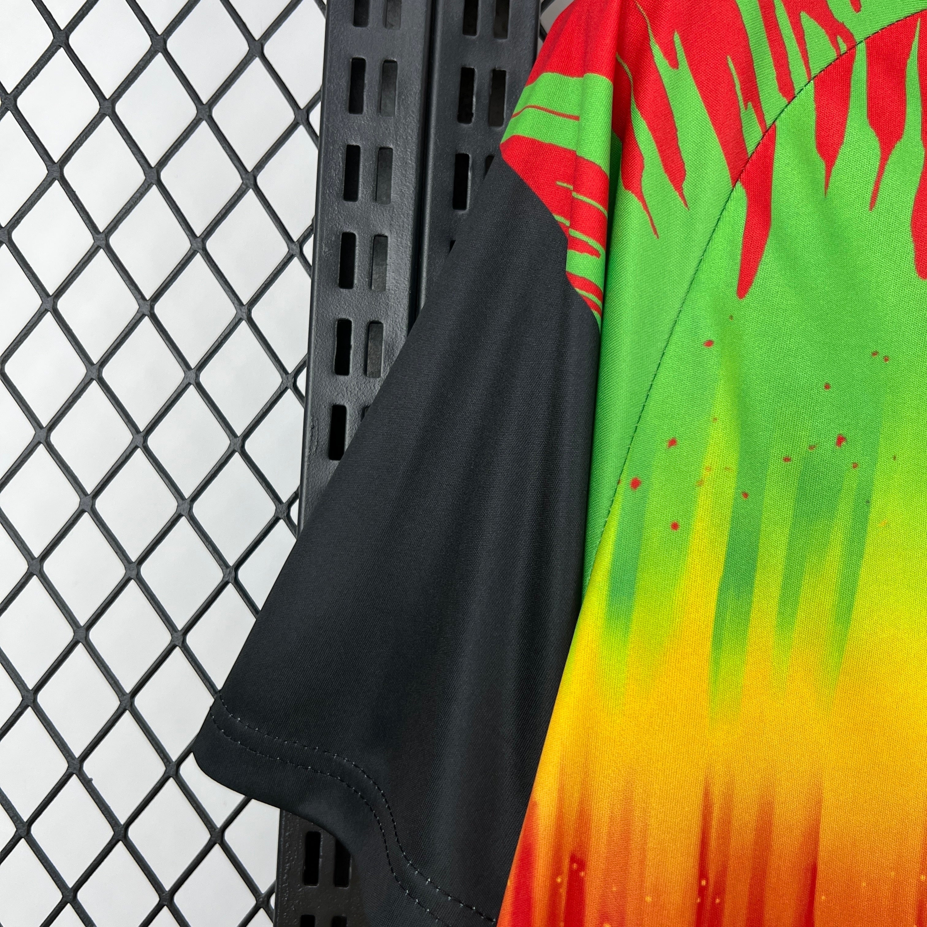 Leazofoot Jamaica 2026 pre-match jersey featuring a vibrant red, yellow, and green gradient with black sleeves.