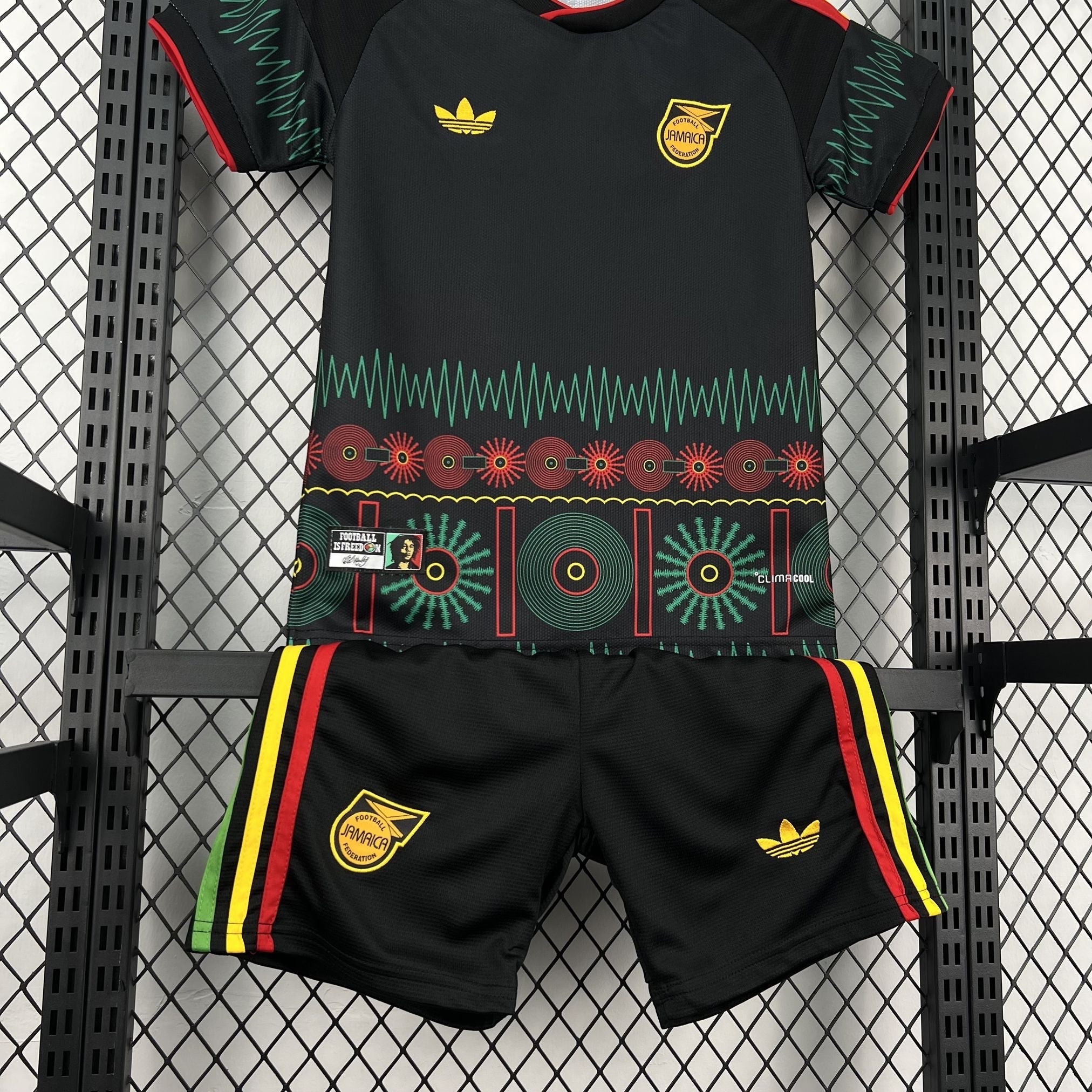 Leazofoot Jamaica 2026 kids outdoor soccer kit in black with green, red, and yellow graphic patterns and logos.