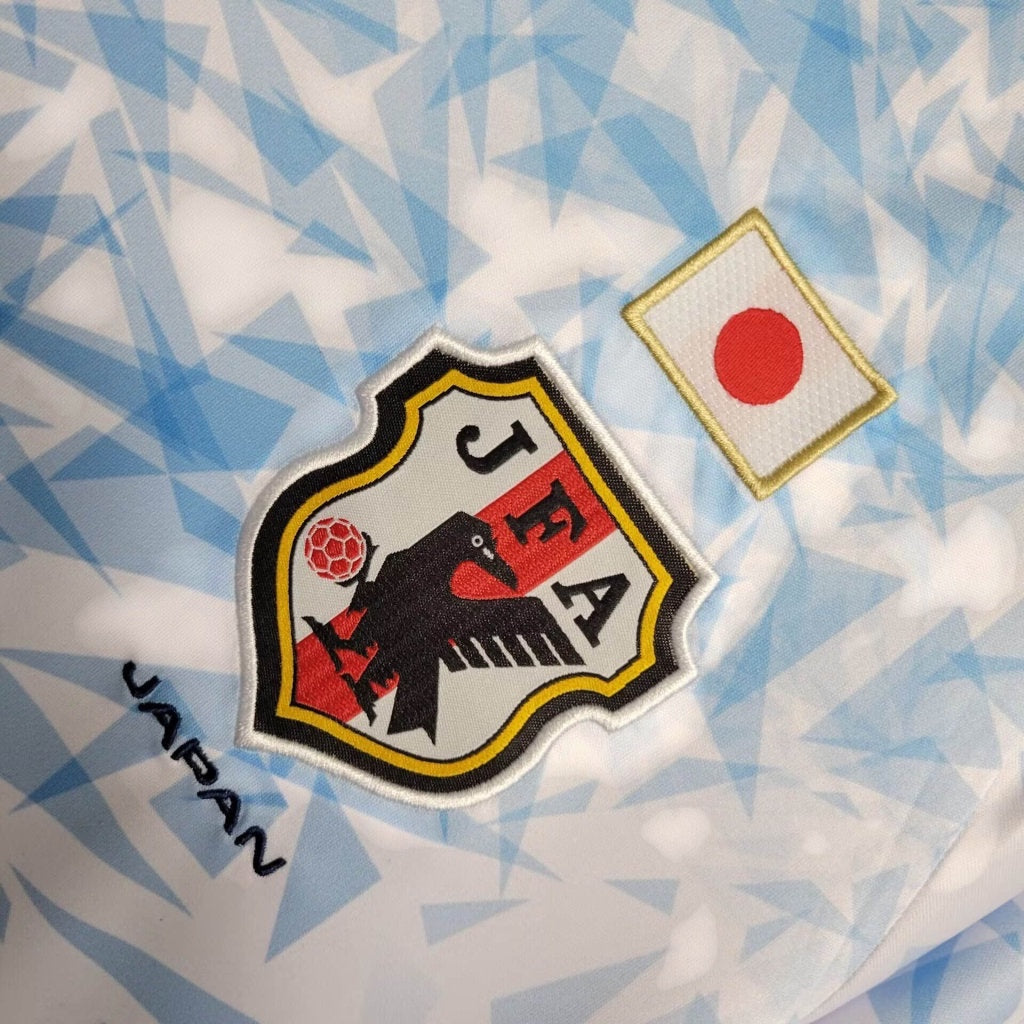 Leazofoot Japan 2023 soccer jersey featuring the JFA crest and Japanese flag on a light blue geometric pattern fabric.