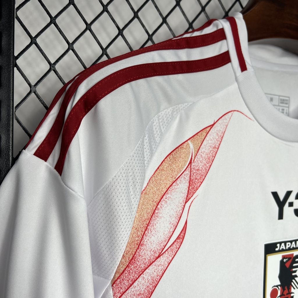 Leazofoot Japan 2024 away soccer jersey in white with red shoulder stripes and unique flame-like graphic detail.