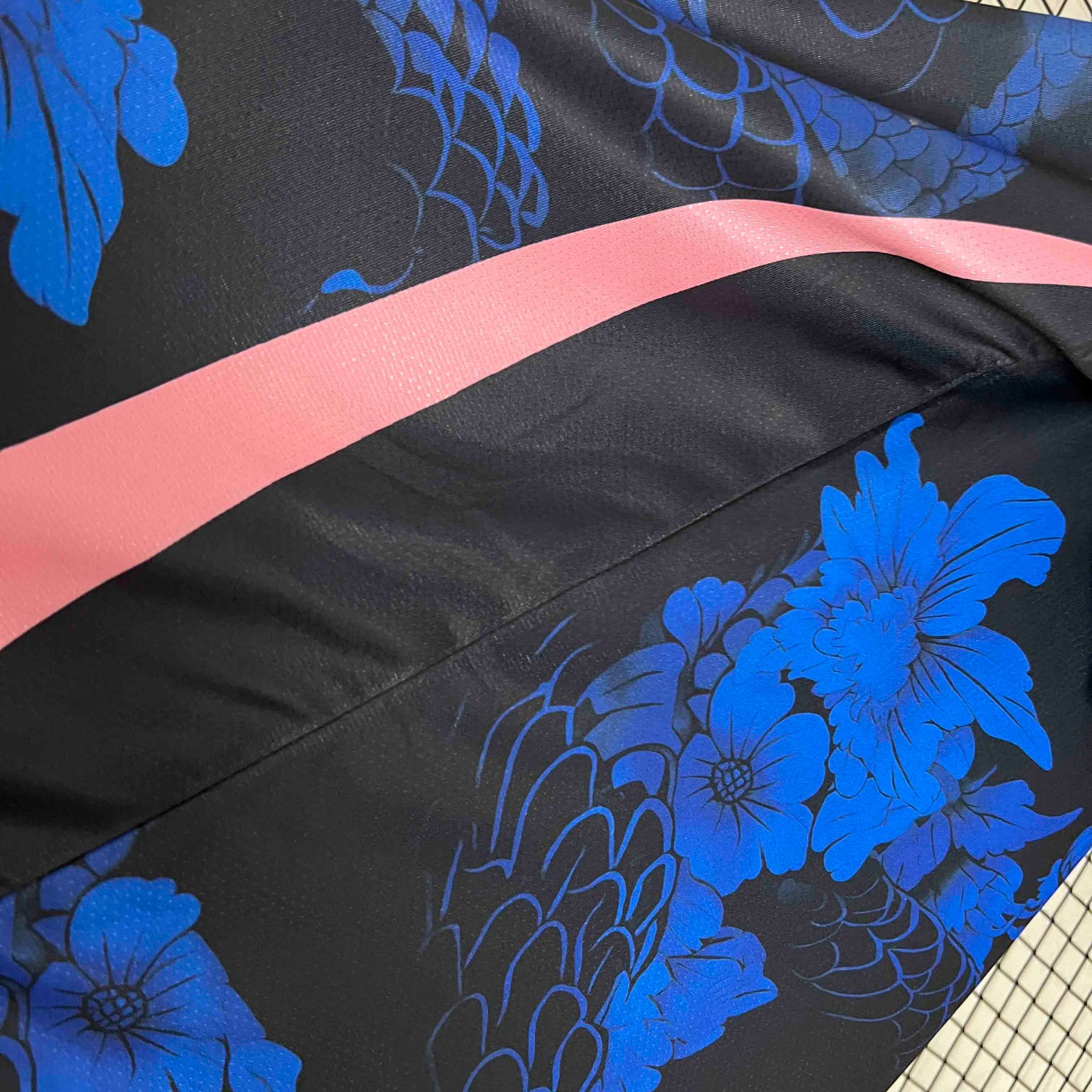 Leazofoot Japan 2024 concept soccer jersey in black with blue floral dragon patterns and a pink diagonal stripe.