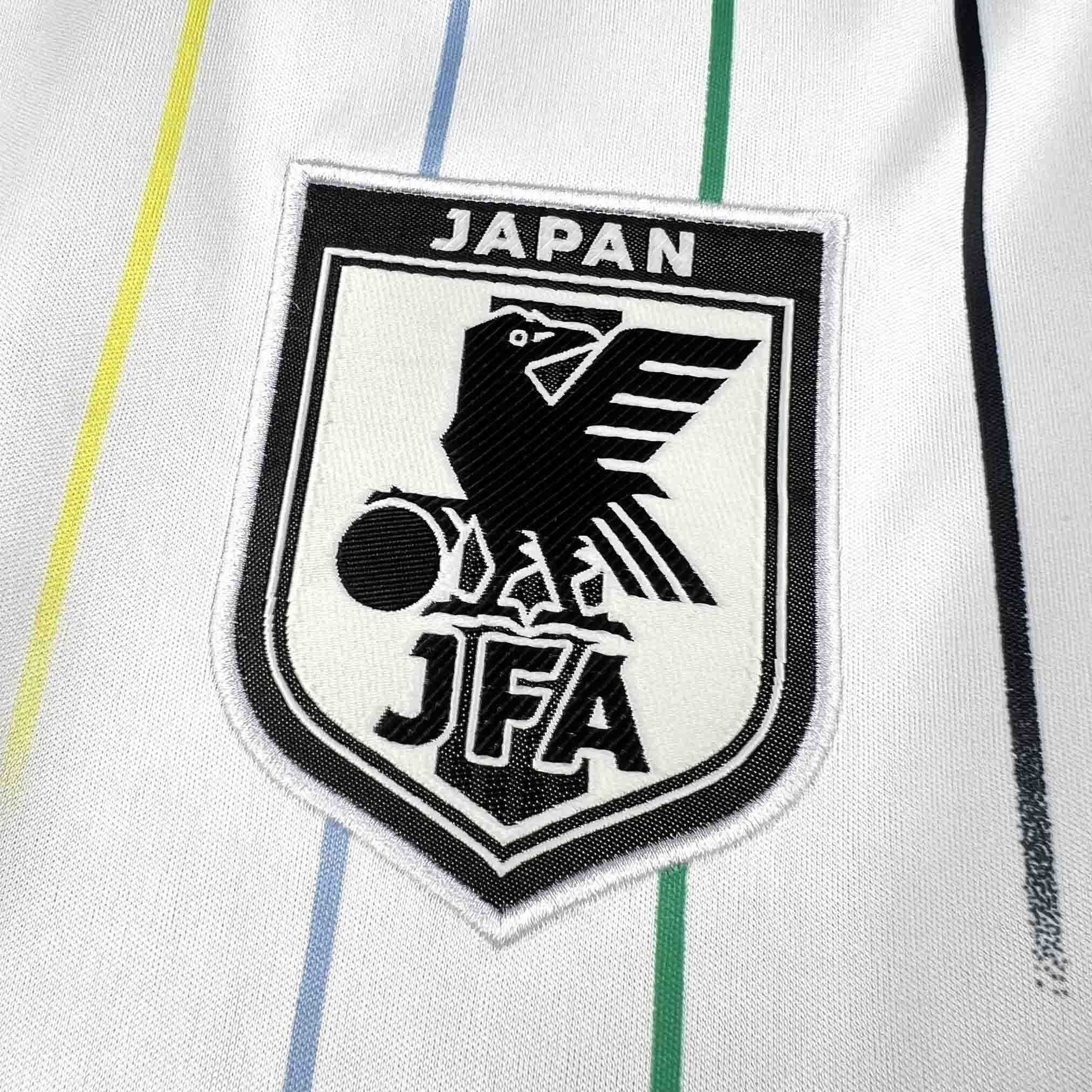 Leazofoot Japan 2026 away jersey with vertical blue, yellow, and green stripes and embroidered crest.
