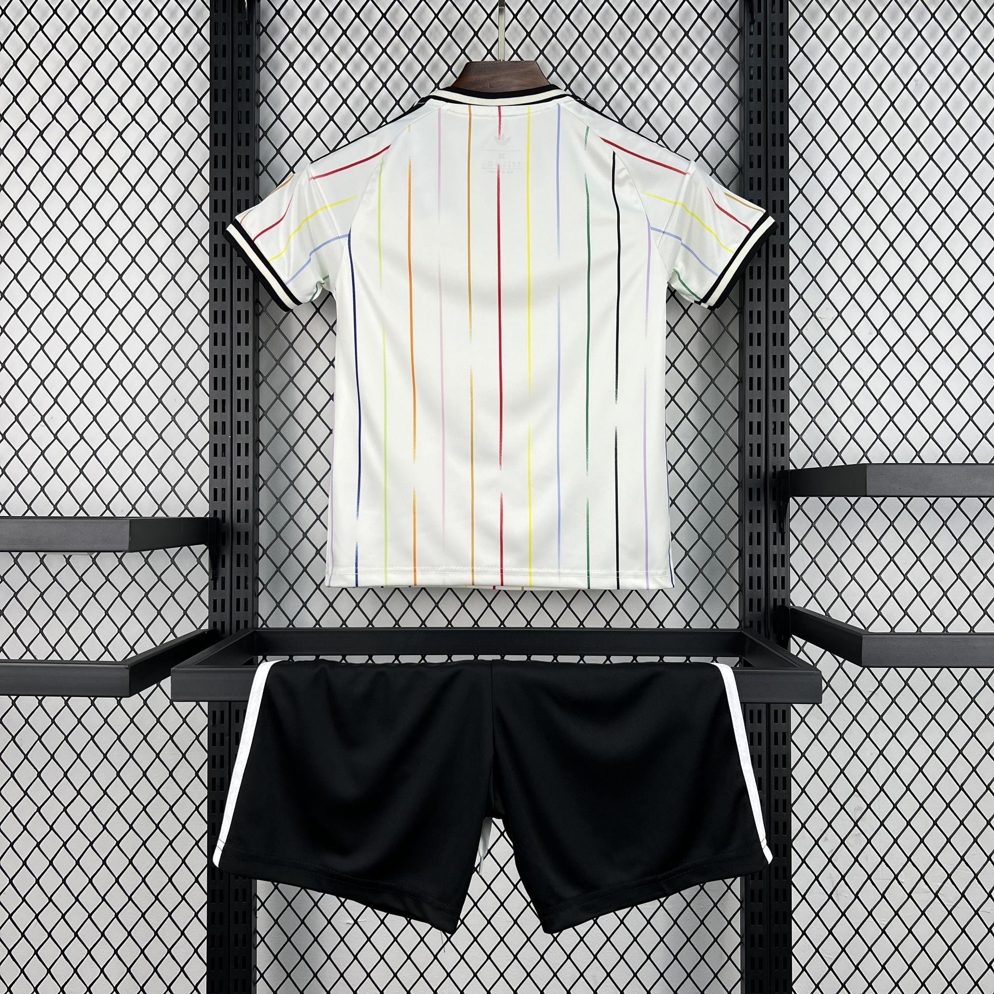 Leazofoot Japan 2026 kids away soccer kit featuring a white jersey with vertical rainbow stripes and black shorts.