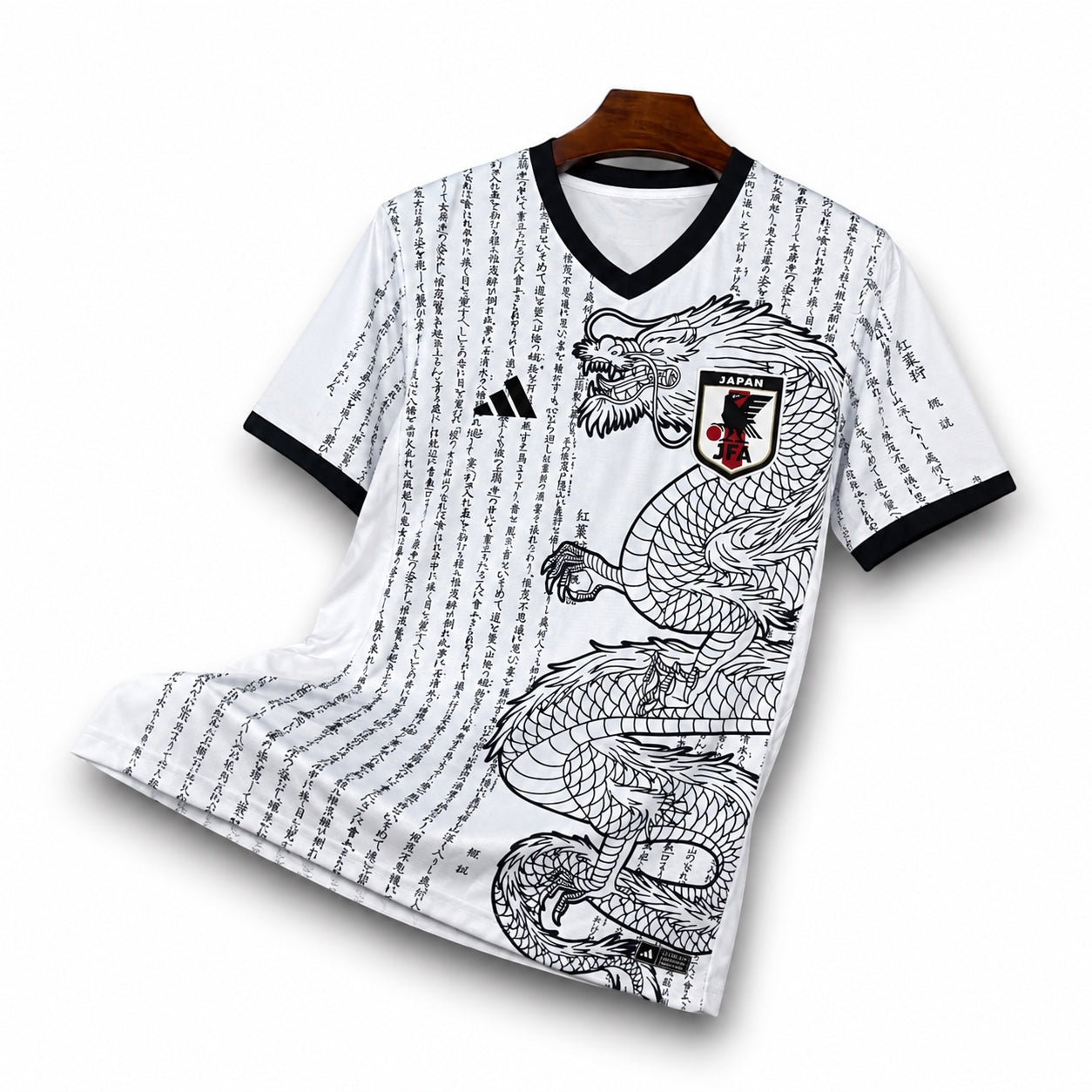 Leazofoot Japan 25/26 soccer jersey in white with black dragon graphic, Japanese calligraphy, and V-neck collar.