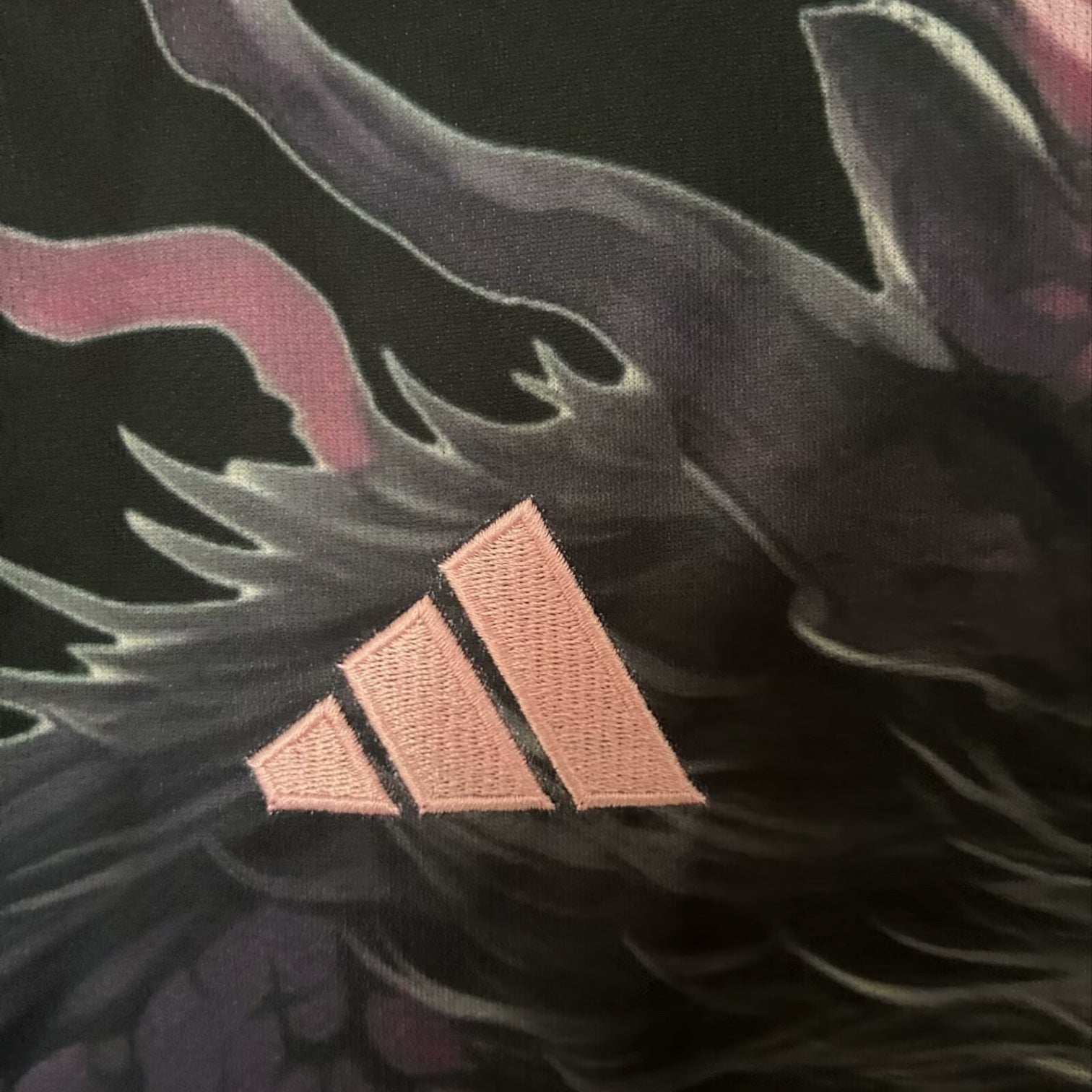 Leazofoot Japan 2024 concept jersey featuring a black fabric with a detailed dragon print and pink embroidered logo
