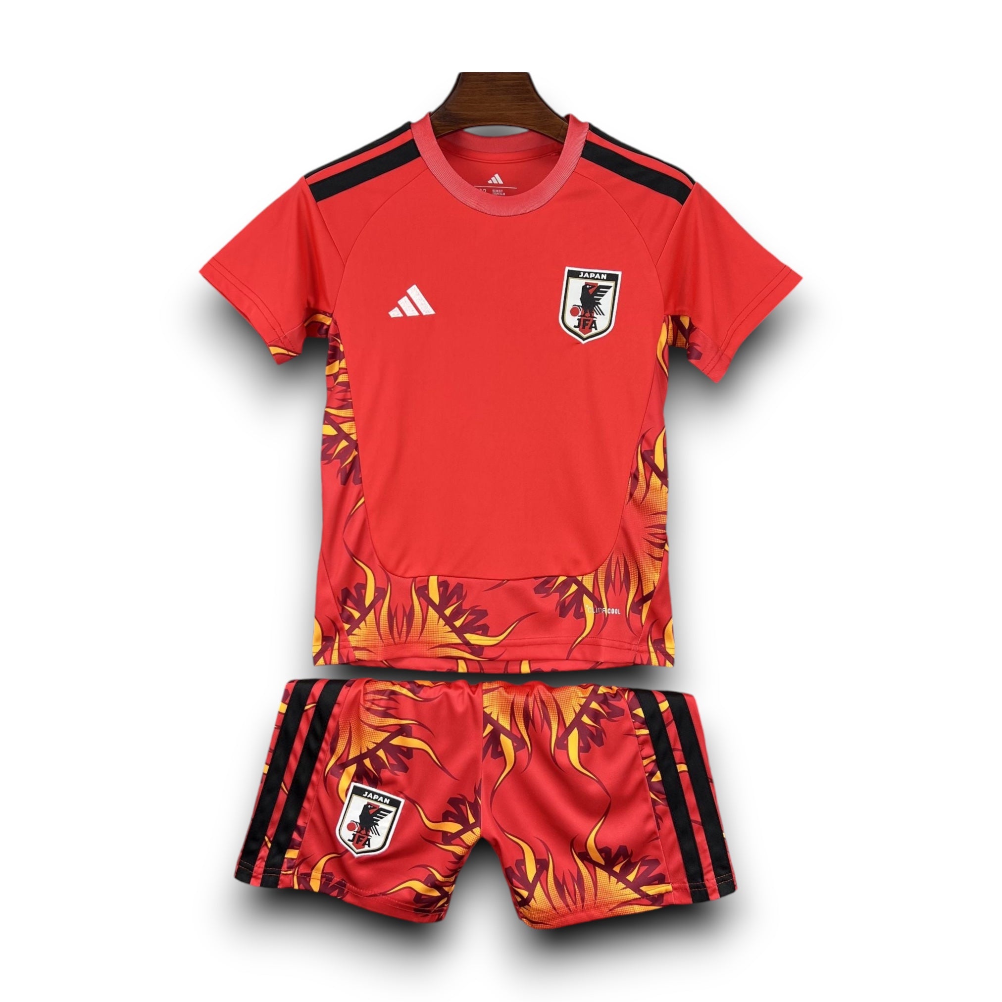 Leazofoot Japan goalkeeper football kit 2026, red shirt and shorts with flame graphic and black stripes.