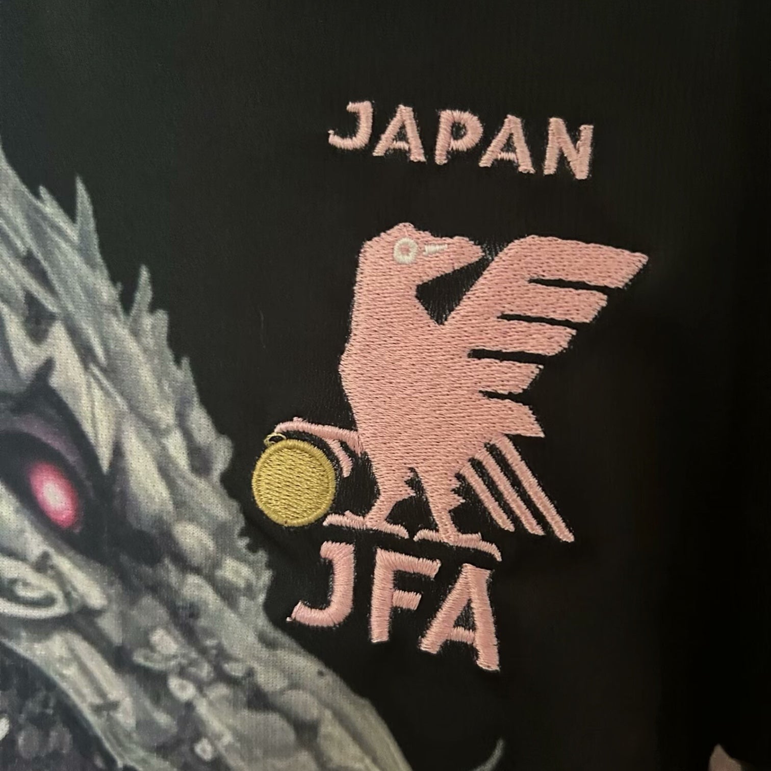 Leazofoot Japan JFA concept jersey featuring a pink embroidered crow emblem and dragon graphic on black fabric