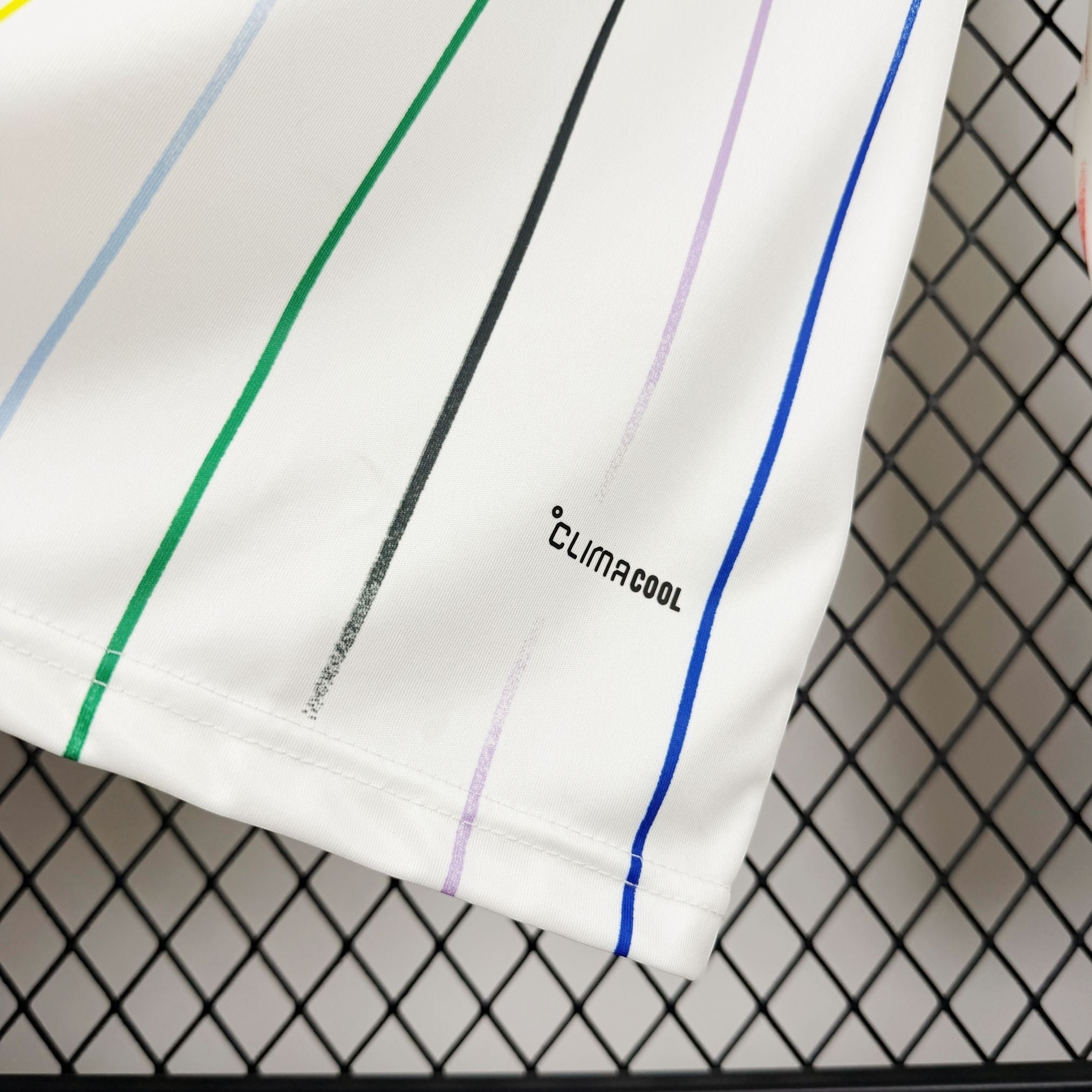Leazofoot white long sleeve football jersey with multi-colored stripes and Climacool technology.