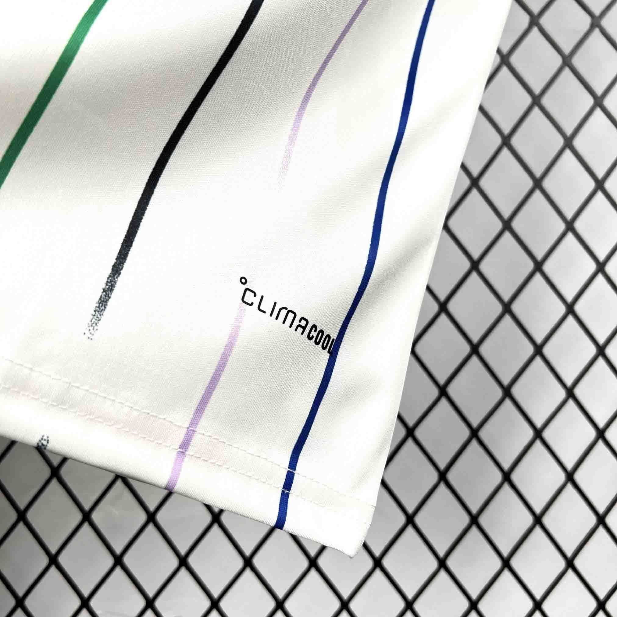 Leazofoot JAPON 2026 away jersey with white base and multi-colored vertical stripes. Features Climacool technology.