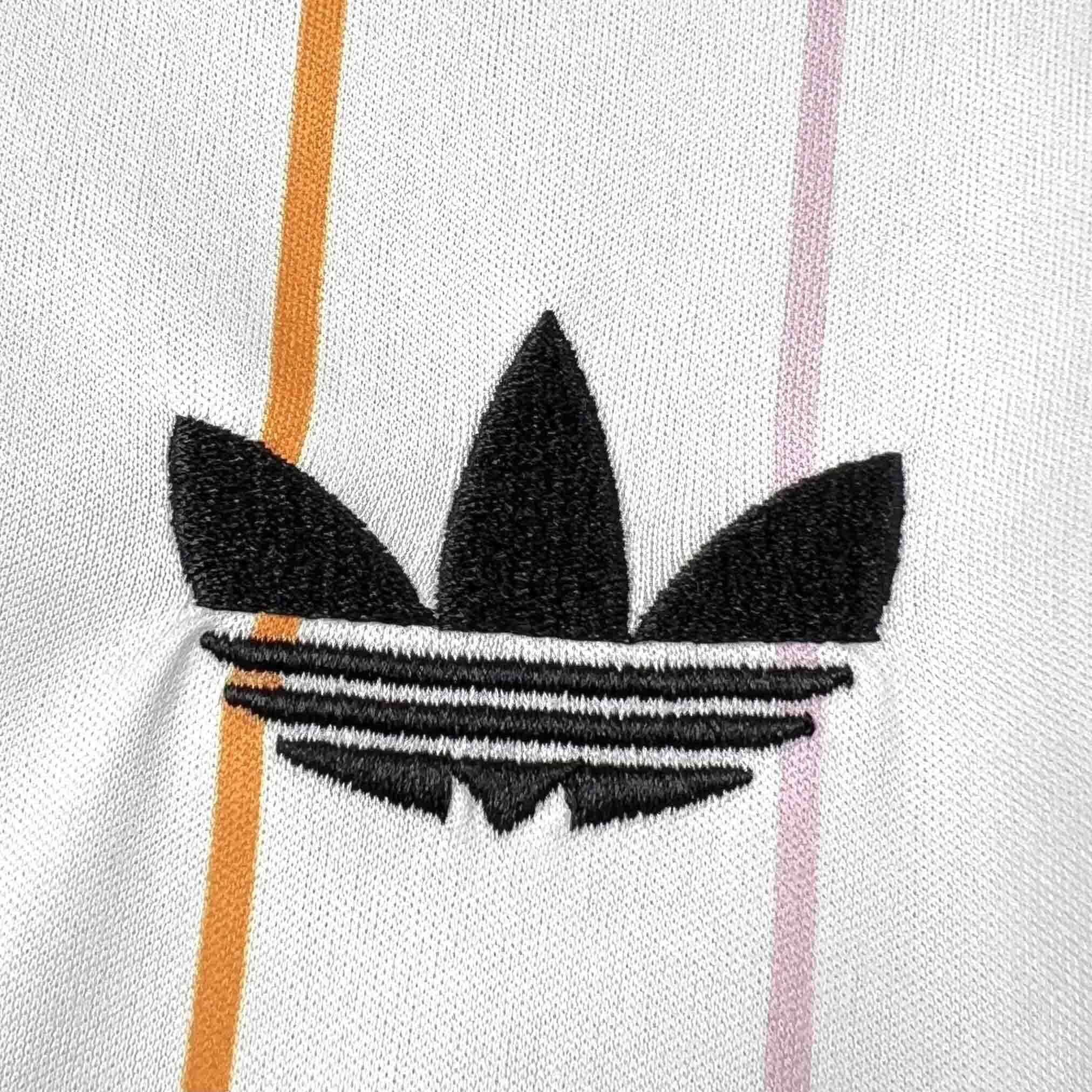 Leazofoot JAPON 2026 away jersey with black Adidas logo and orange and pink vertical stripes.