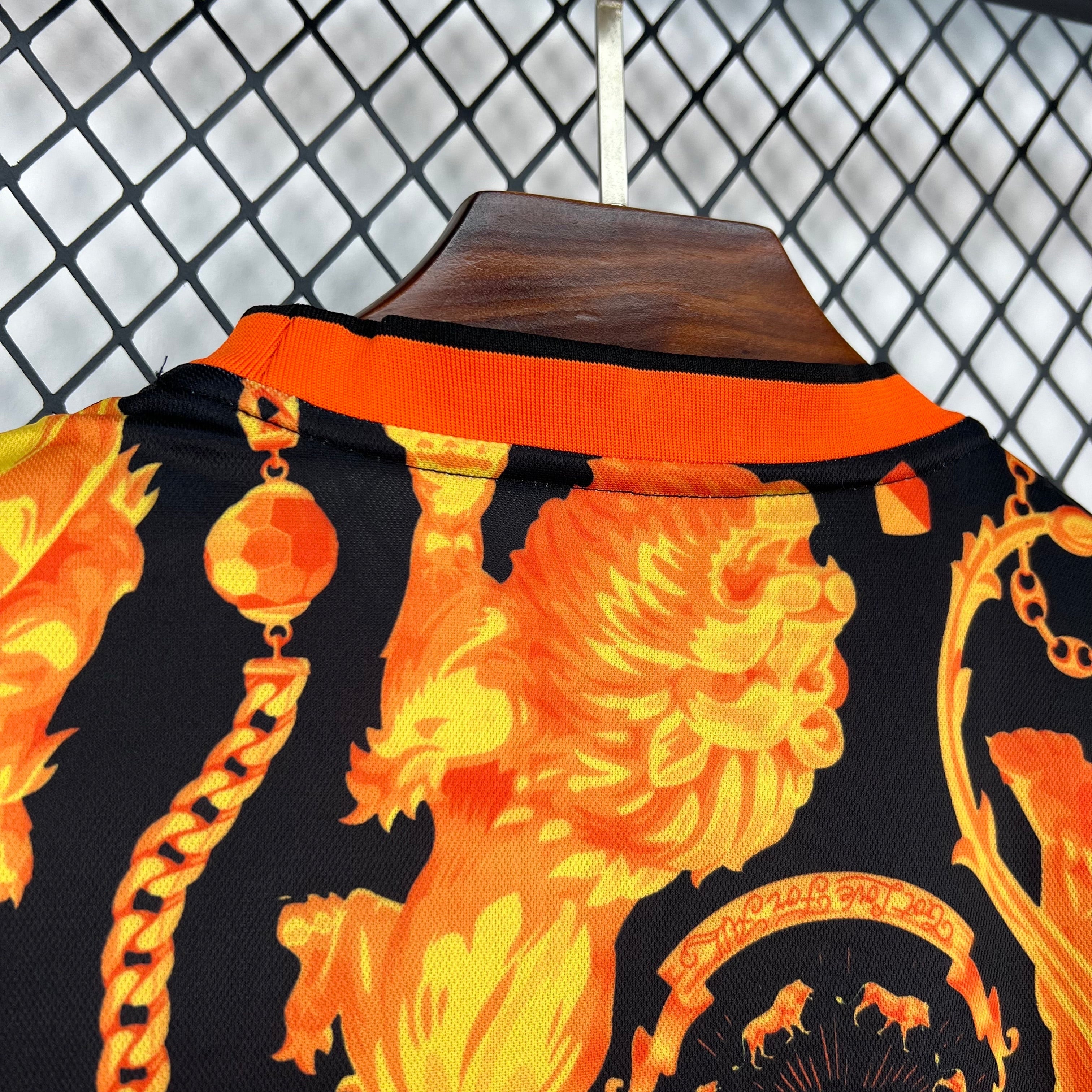 Leazofoot black and orange lion print football jersey with chain detail and ribbed collar