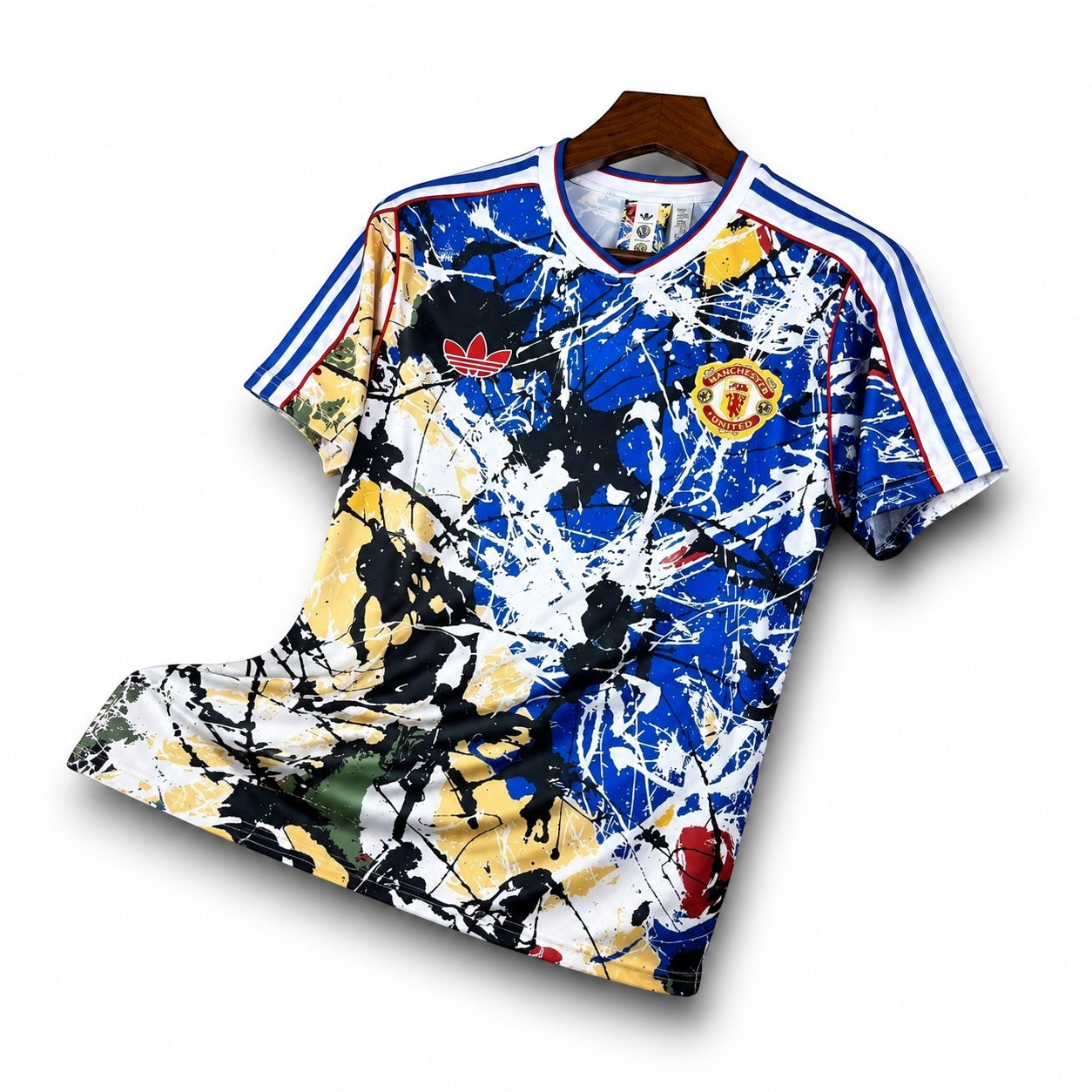 Leazofoot Manchester United 26/27 concept football jersey with a blue, white, and yellow paint splatter design.