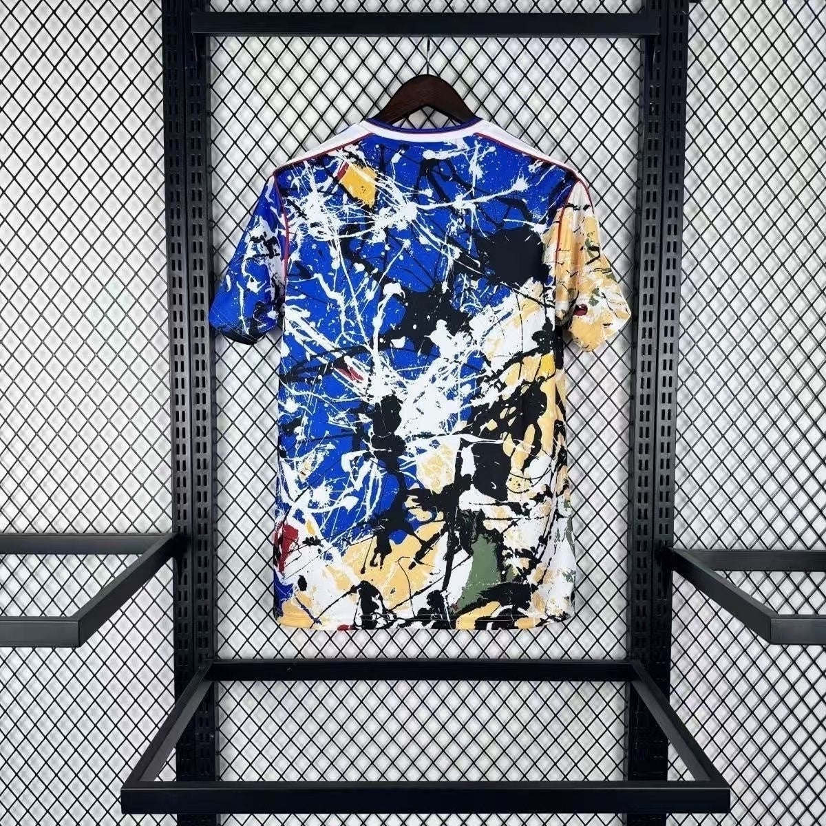 Leazofoot Manchester United 26/27 concept jersey featuring a vibrant blue, white, and yellow paint splatter design.