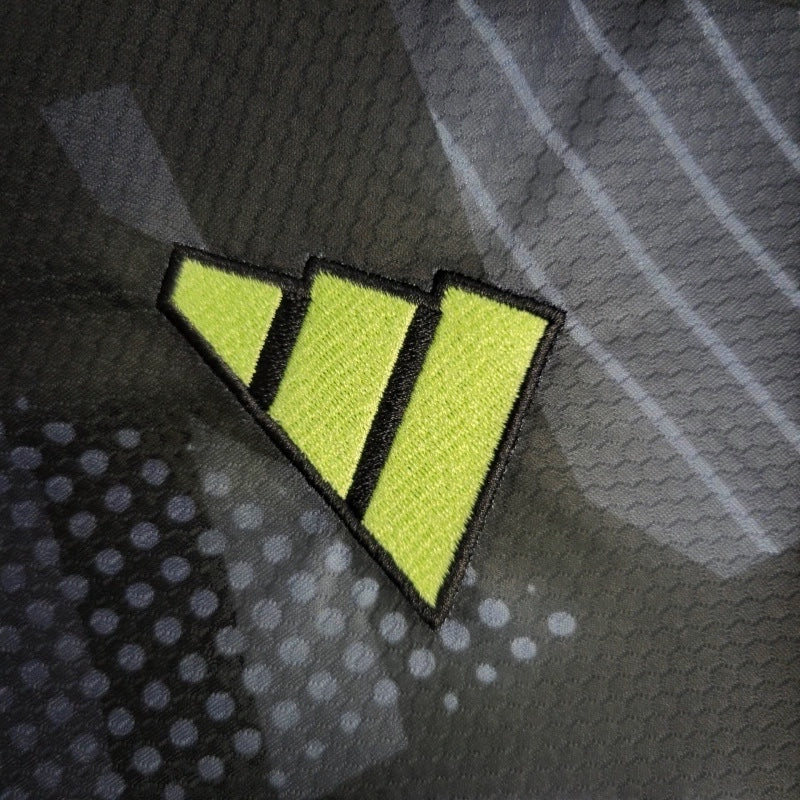 Leazofoot 2010 Mexico away jersey featuring a lime green embroidered logo on a black patterned technical fabric.