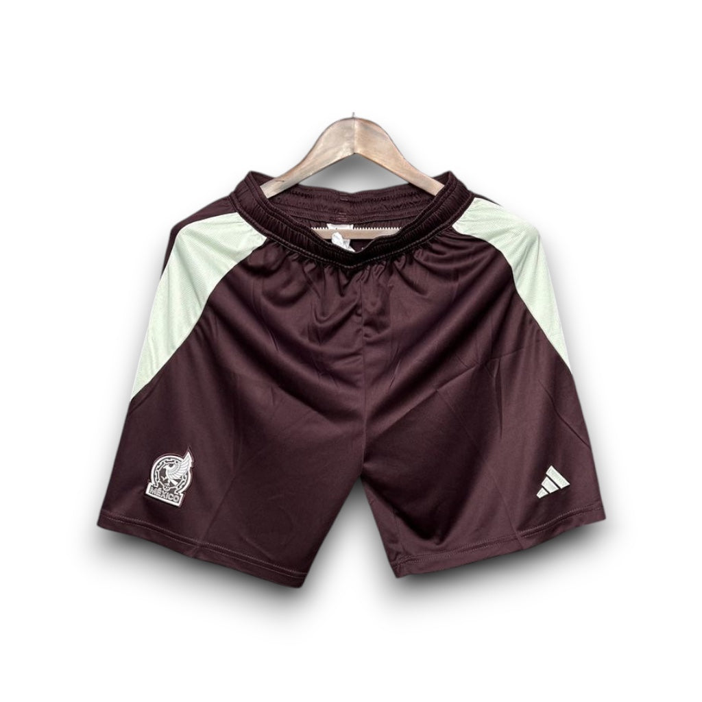 Leazofoot Mexico 2024 concept soccer shorts in maroon with white side panels and team crest on a hanger.