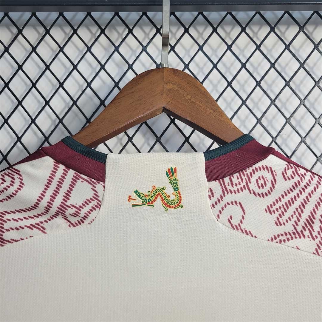Leazofoot Mexico 24/25 special edition soccer jersey in off-white with maroon trim and Aztec-inspired dragon graphic.