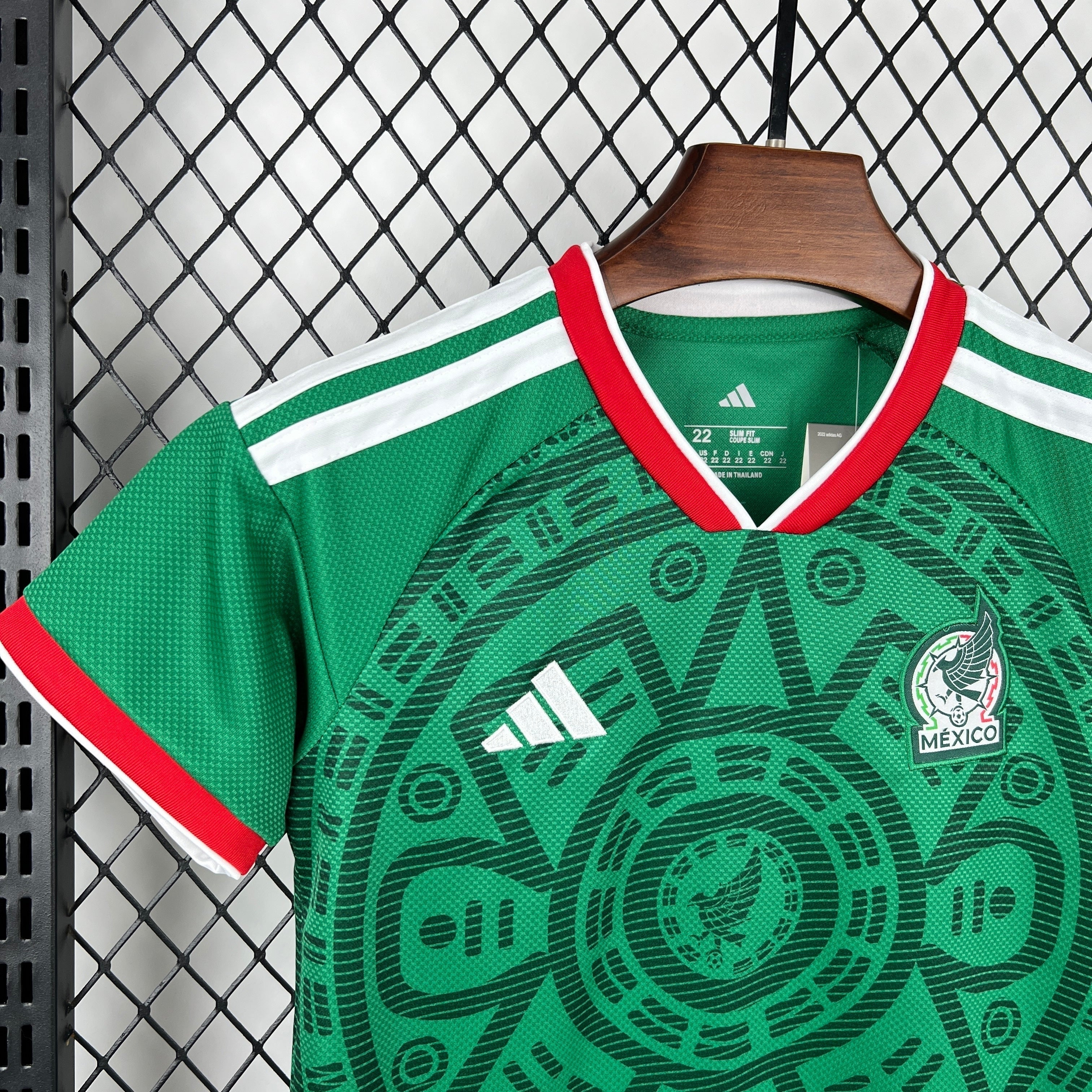 Leazofoot green Mexico national football team home jersey with red and white trim and Aztec-inspired pattern.