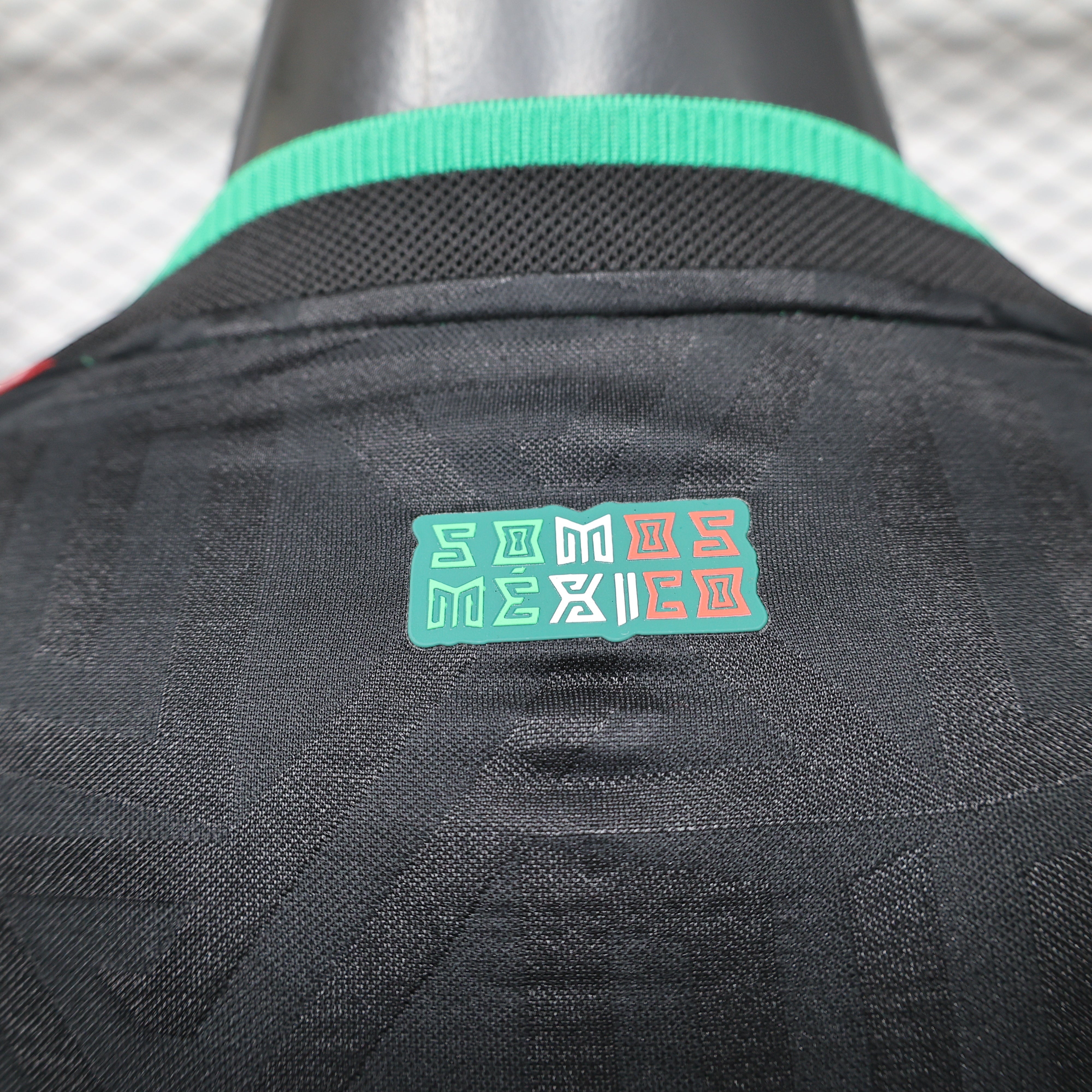 Leazofoot Mexico black long sleeve player jersey with green collar detail and "SOMOS MEXICO" graphic.